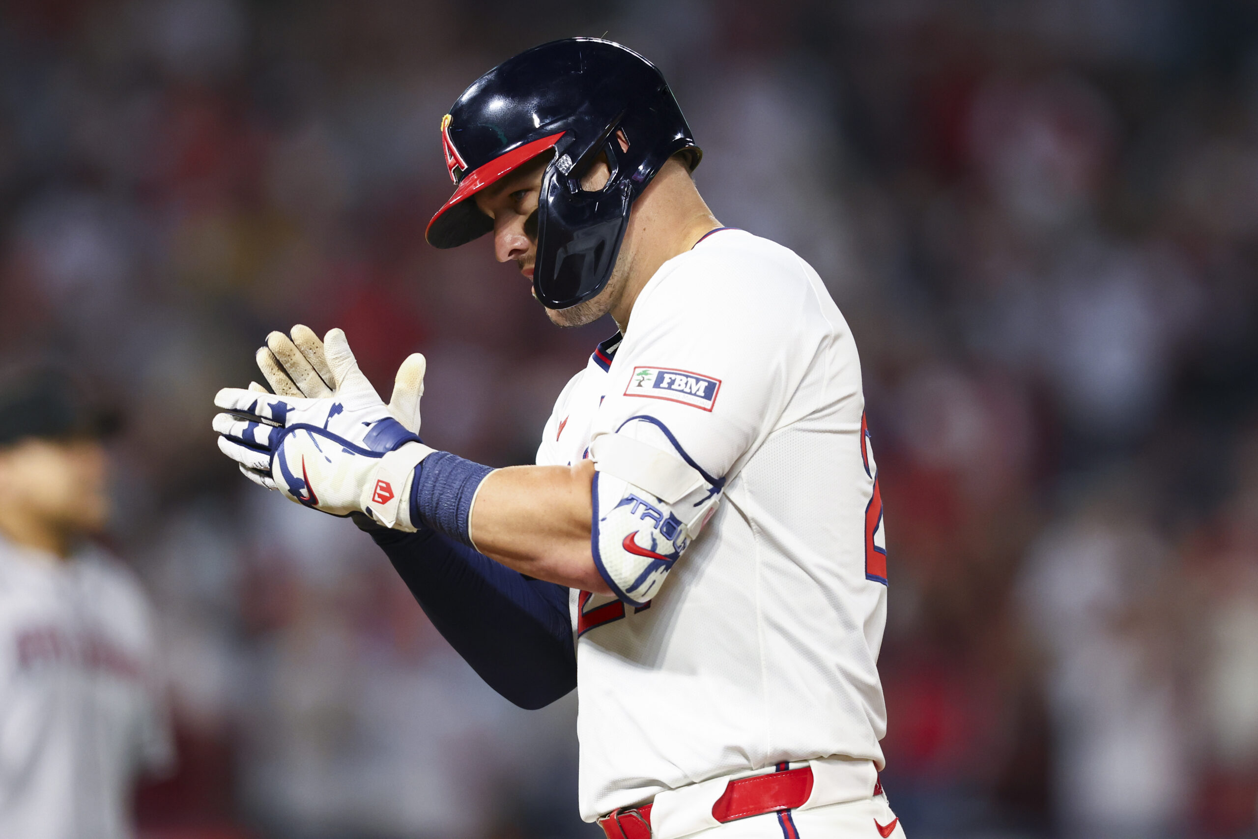 Angels’ Mike Trout celebrates after hitting an RBI single during...