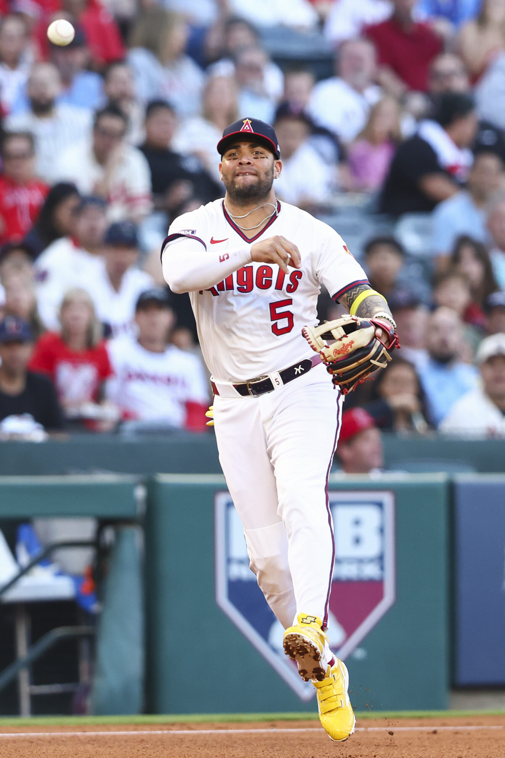 Angels third baseman Yoán Moncada (5) throws to first base...