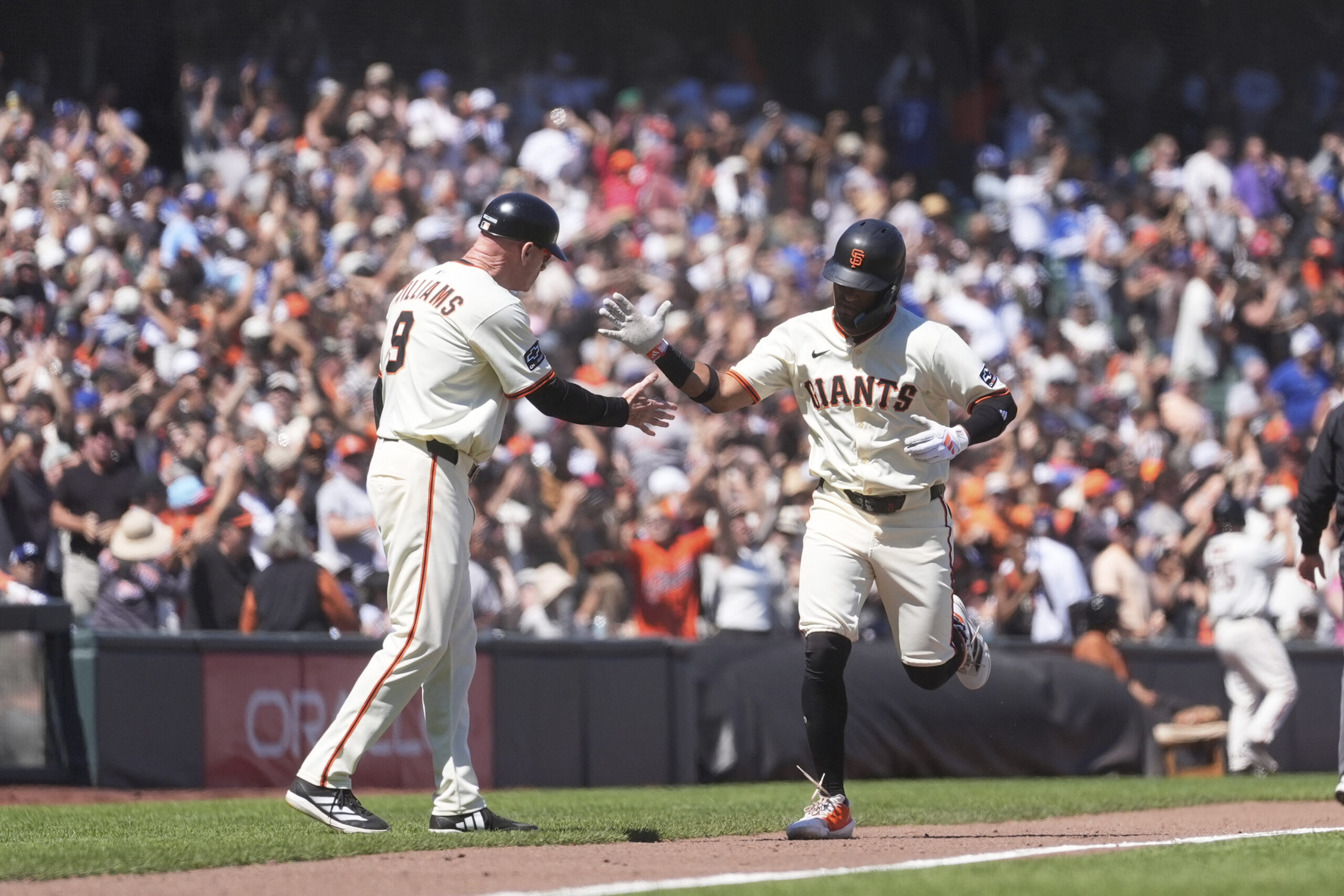 San Francisco Giants’ Luis Matos, right, is congratulated by third...