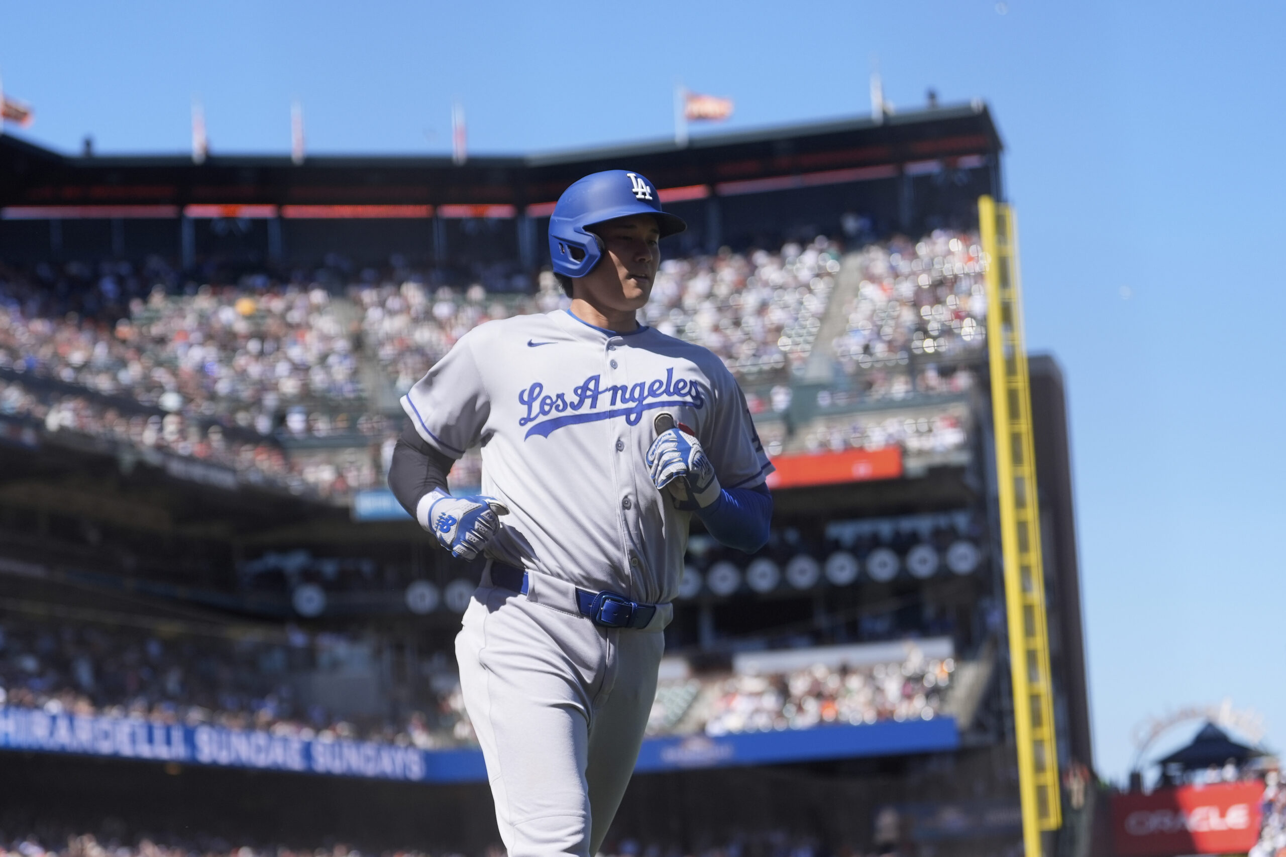 Dodgers’ Shohei Ohtani scores against the San Francisco Giants during...