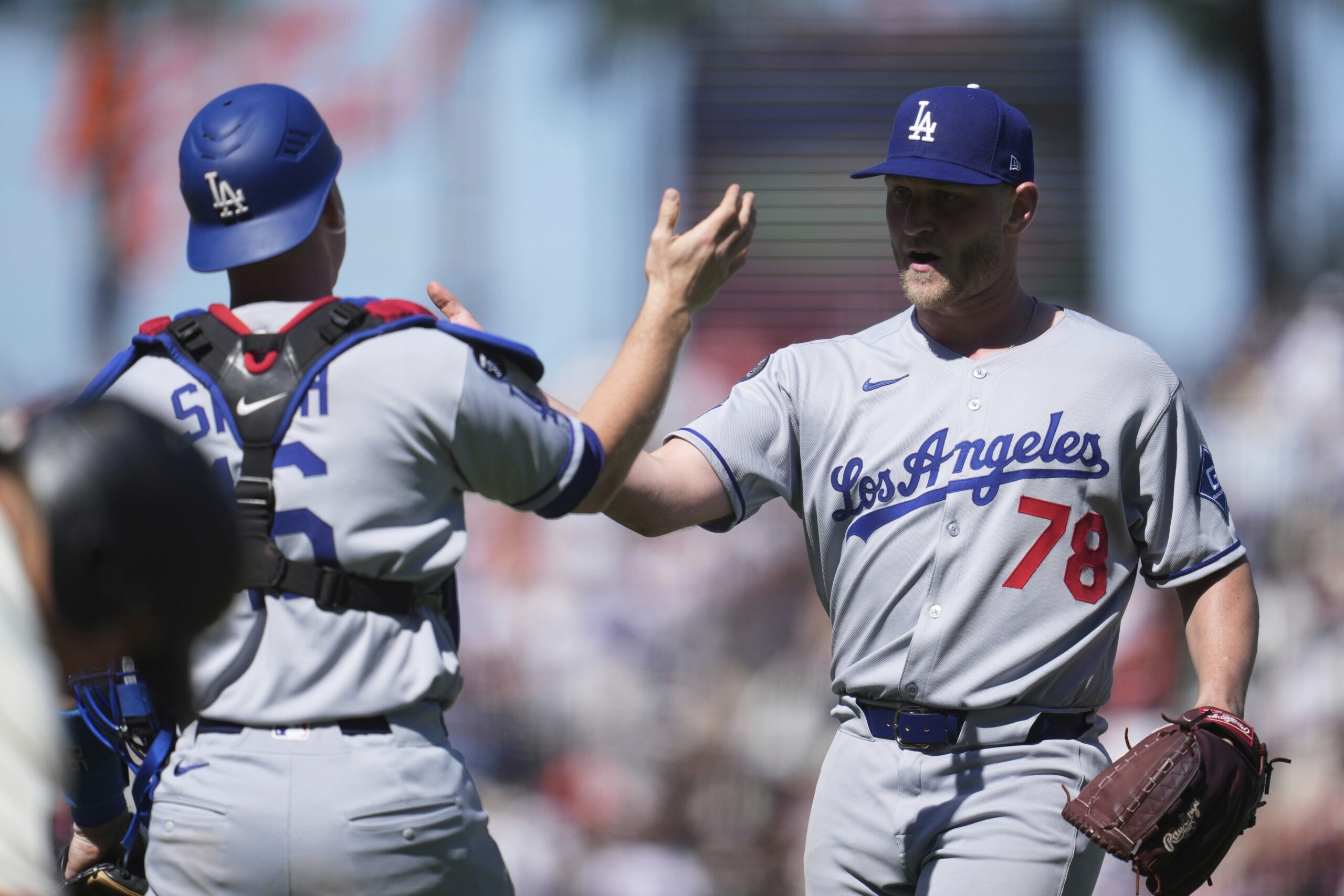 Dodgers catcher Will Smith, left, celebrates with pitcher Ben Casparius...