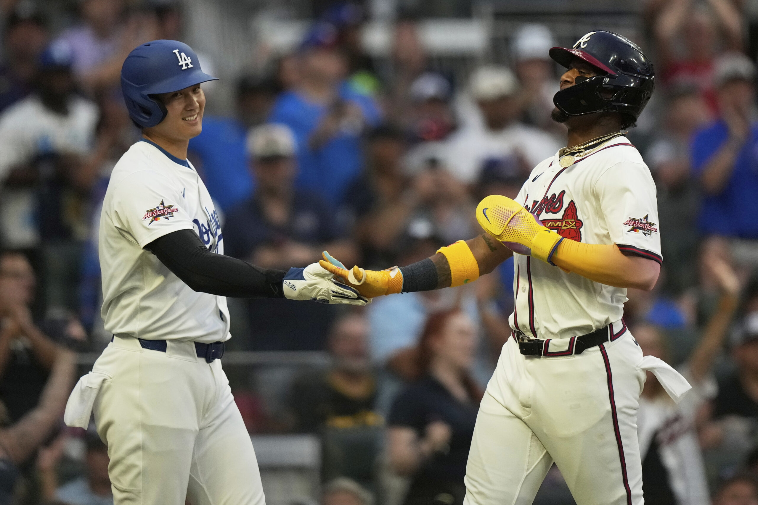 The Dodgers’ Shohei Ohtani, left, and the Atlanta Braves Ronald...