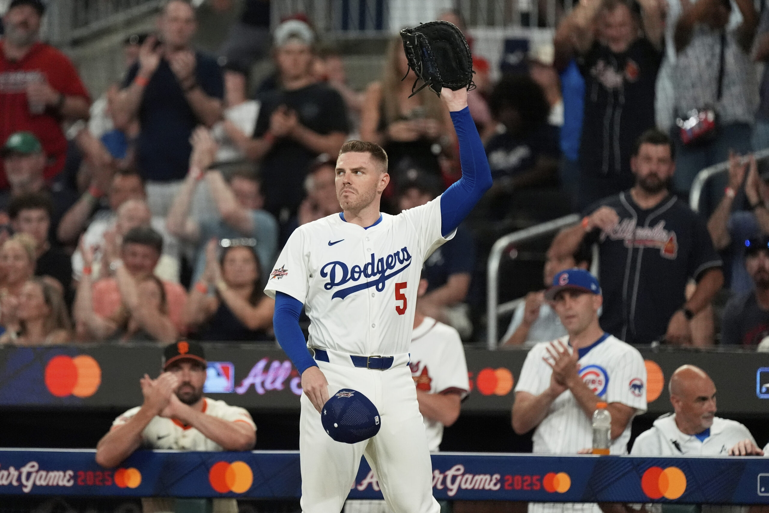 Dodgers first baseman Freddie Freeman waves to the crowd after...