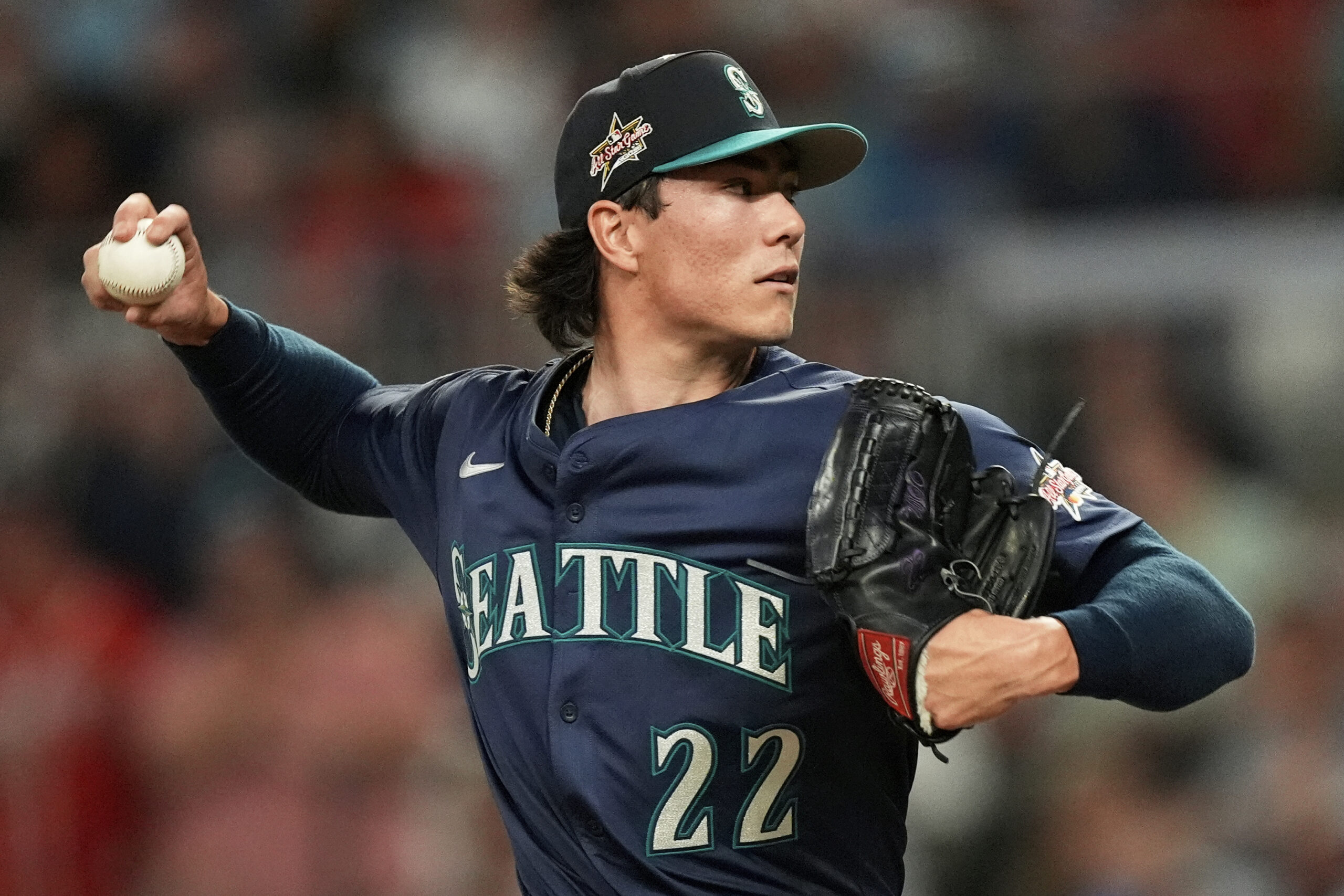 Seattle Mariners pitcher Bryan Woo throws during the third inning...