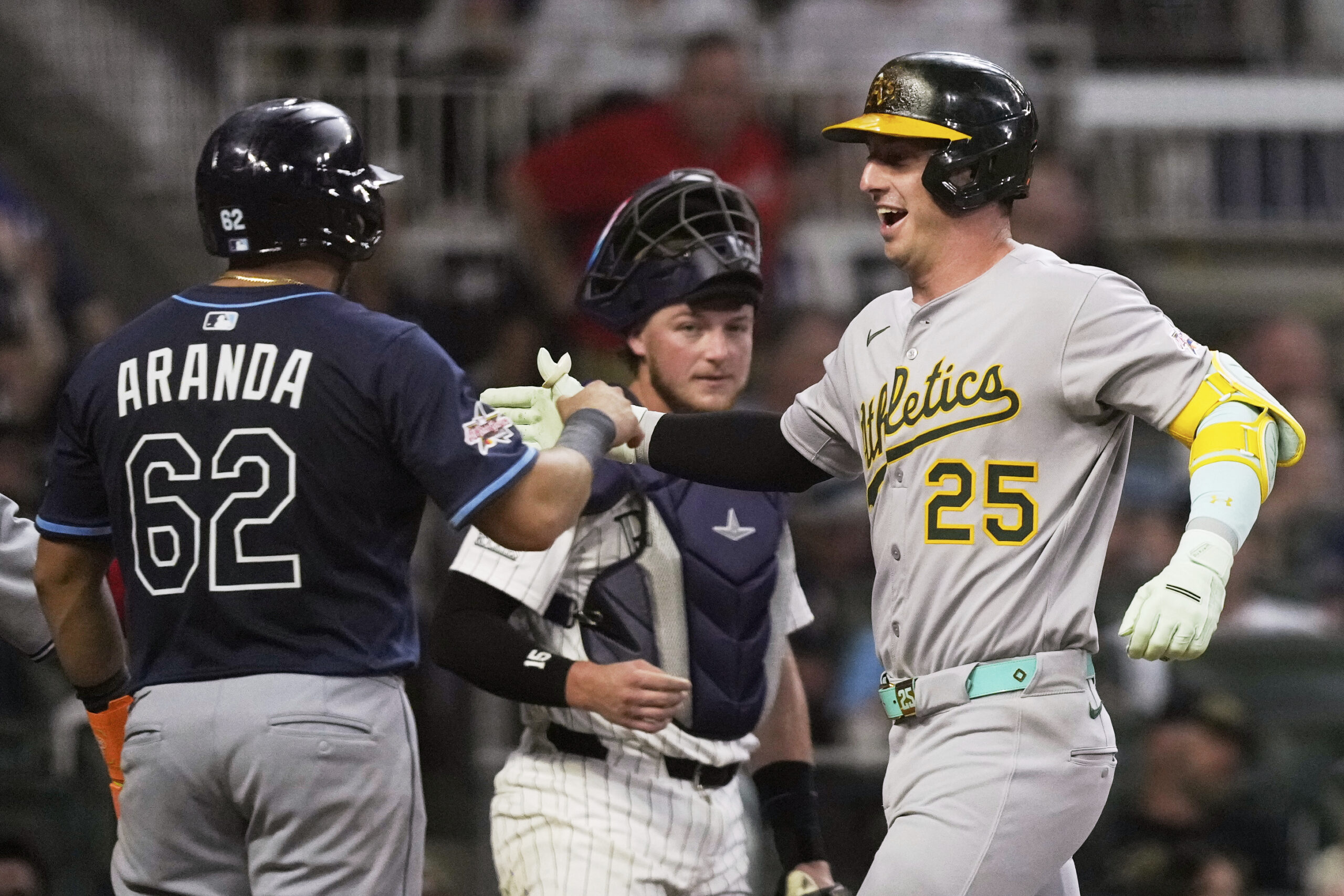The Athletics’ Brent Rooker celebrates his home run during seventh...