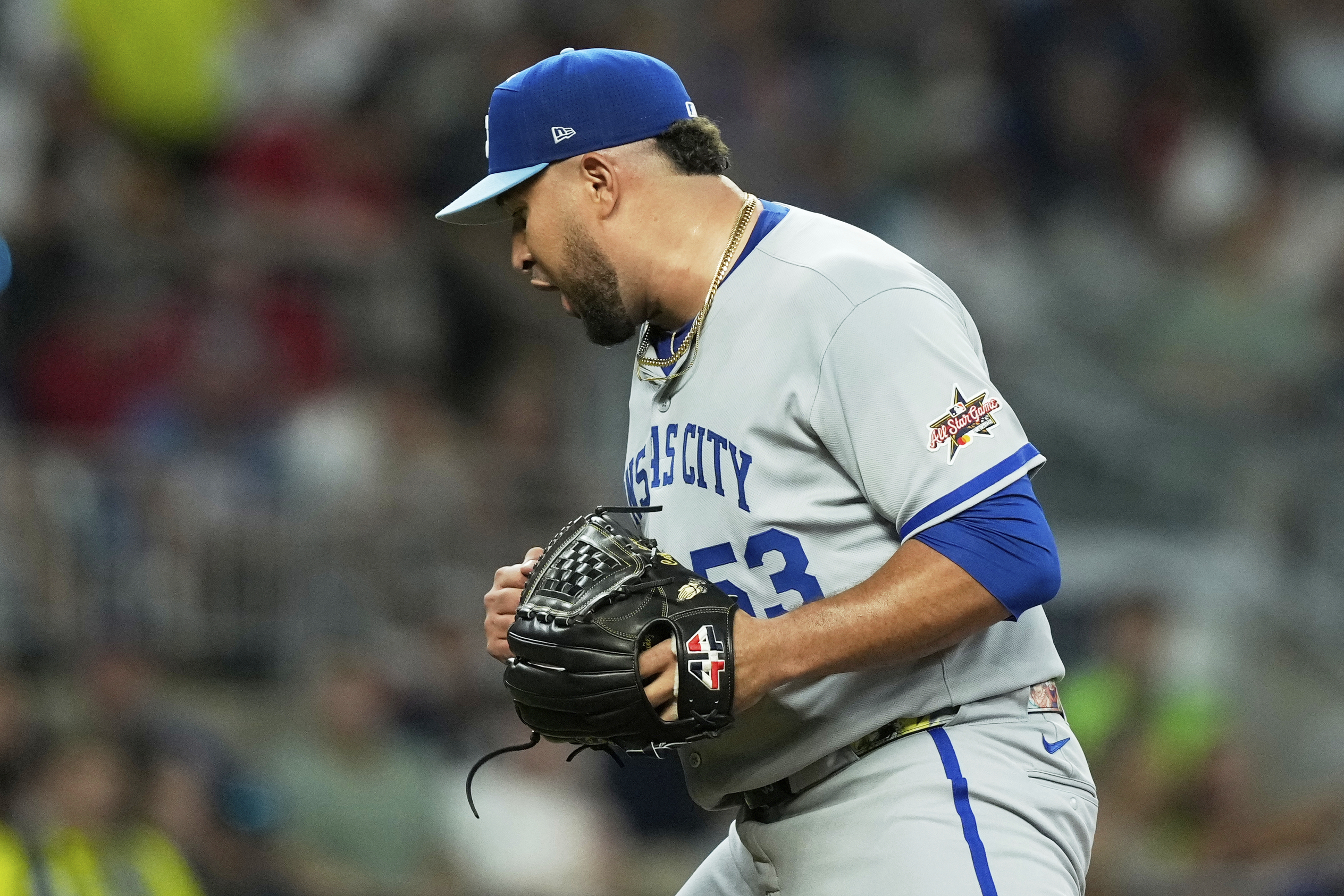 Kansas City Royals pitcher Carlos Estévez celebrates after a out...