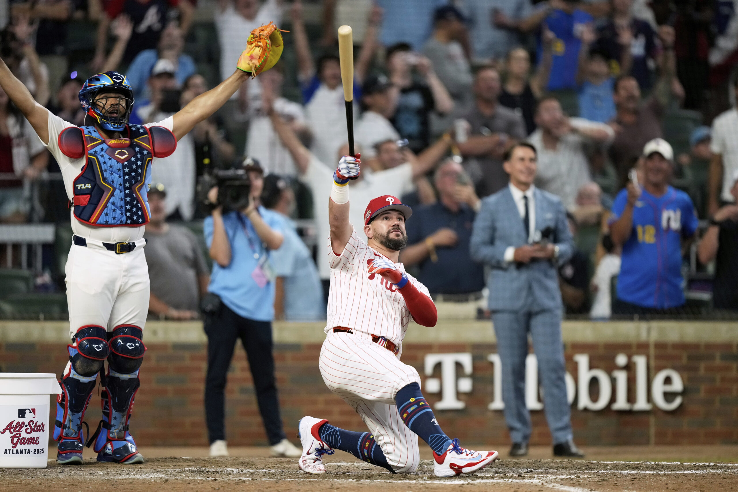 Philadelphia Phillies slugger Kyle Schwarber celebrates after hitting his third...