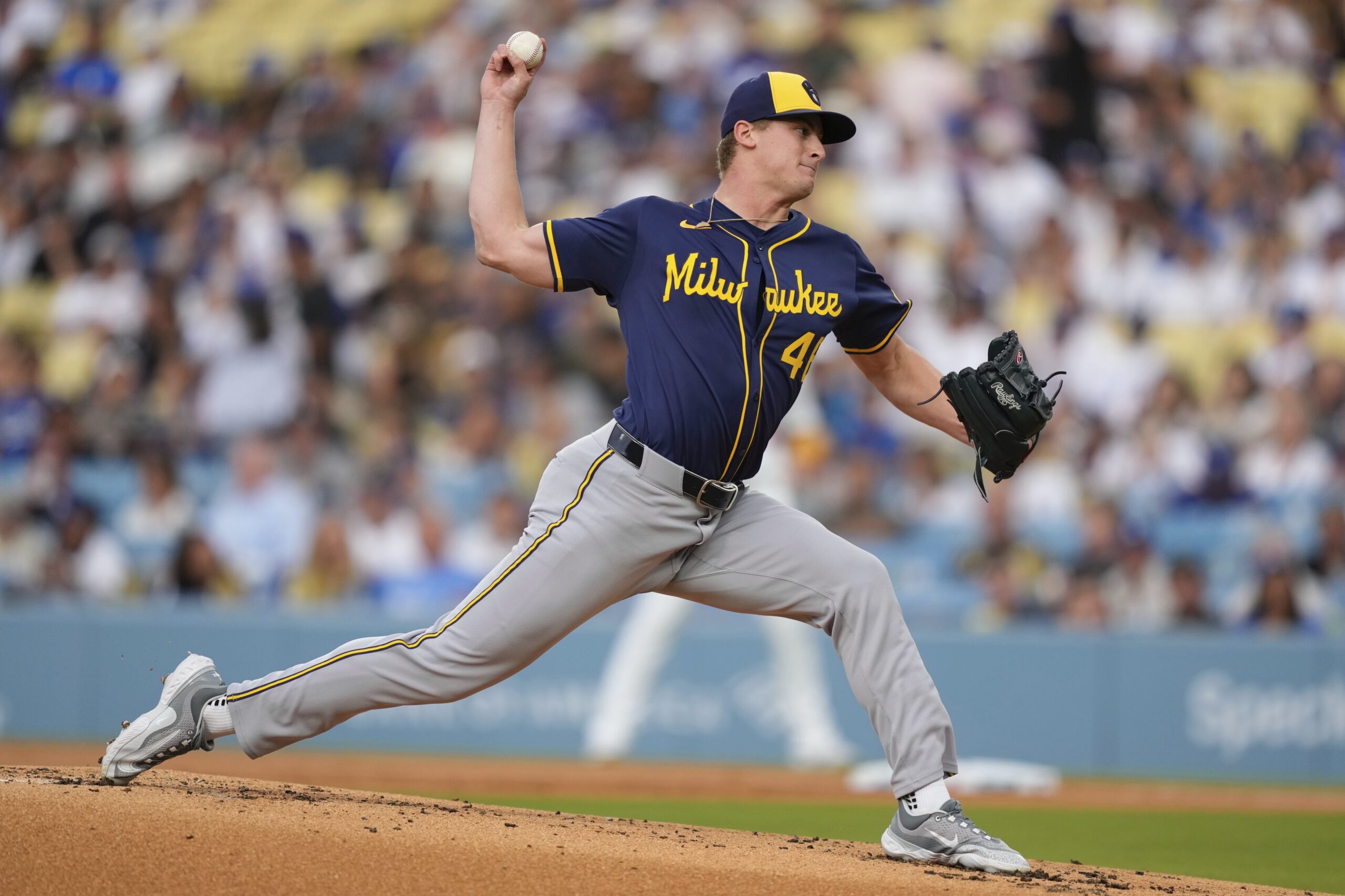 Milwaukee Brewers starting pitcher Quinn Priester throws to the plate...
