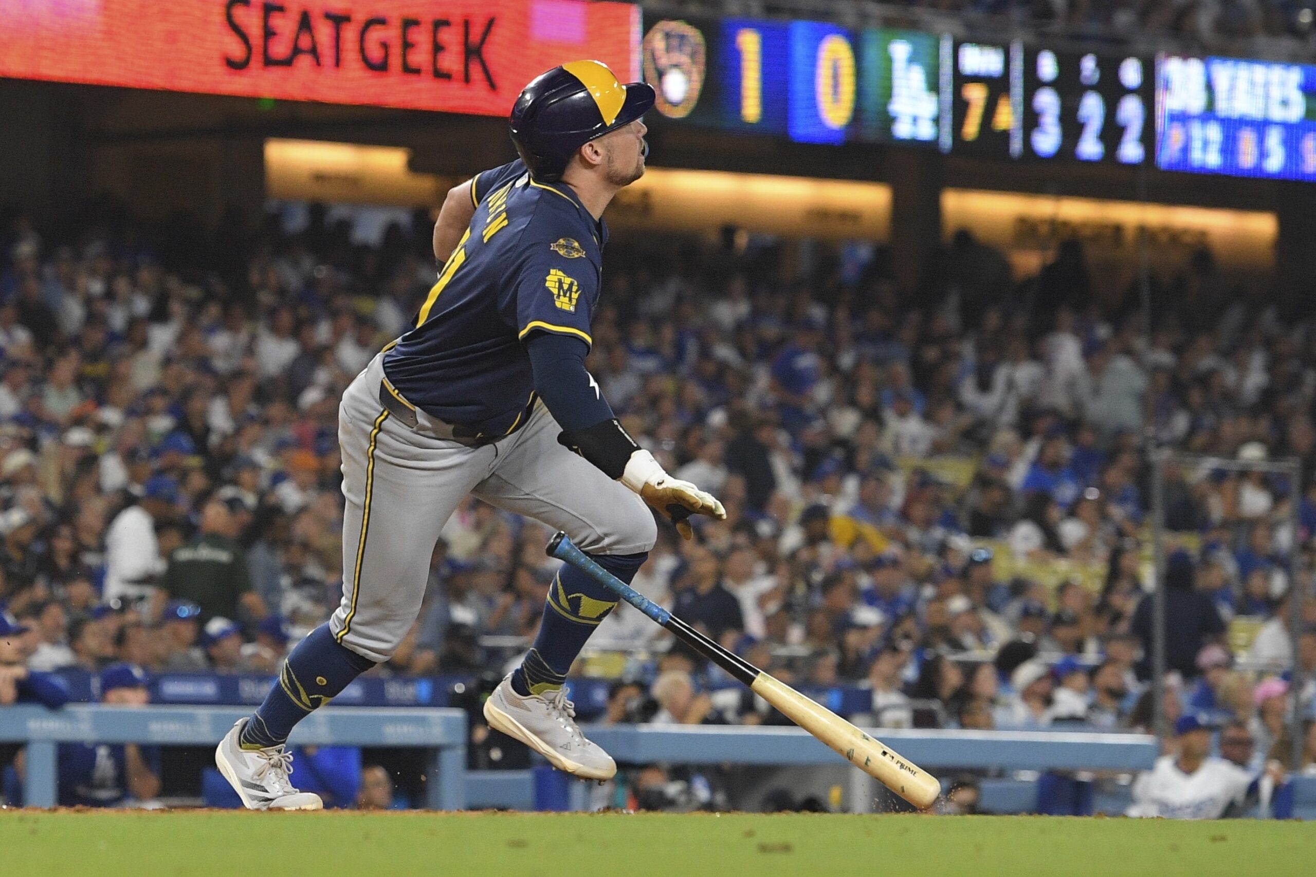 The Milwaukee Brewers’ Caleb Durbin drops his bat as he...