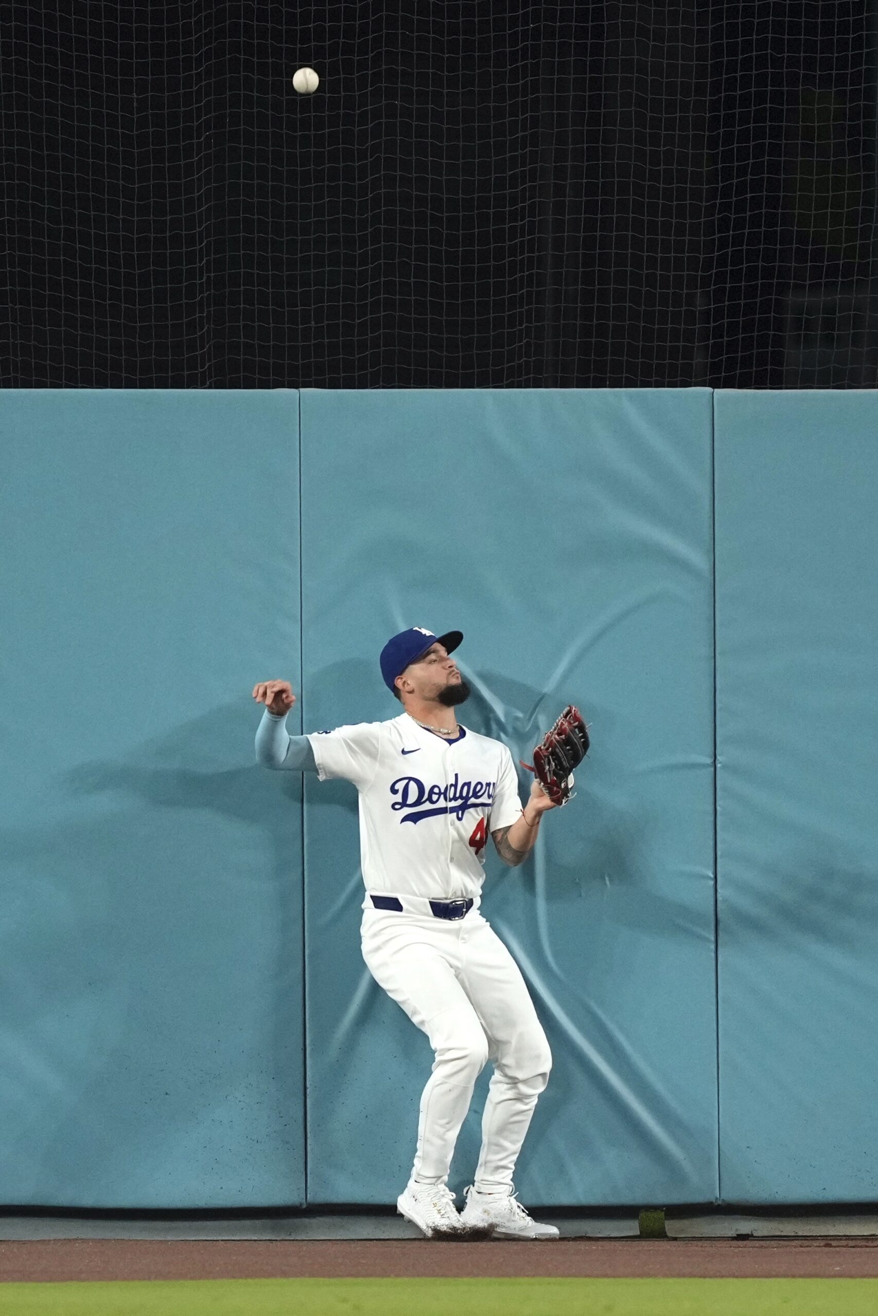 Dodgers center fielder Andy Pages is unable to get to...