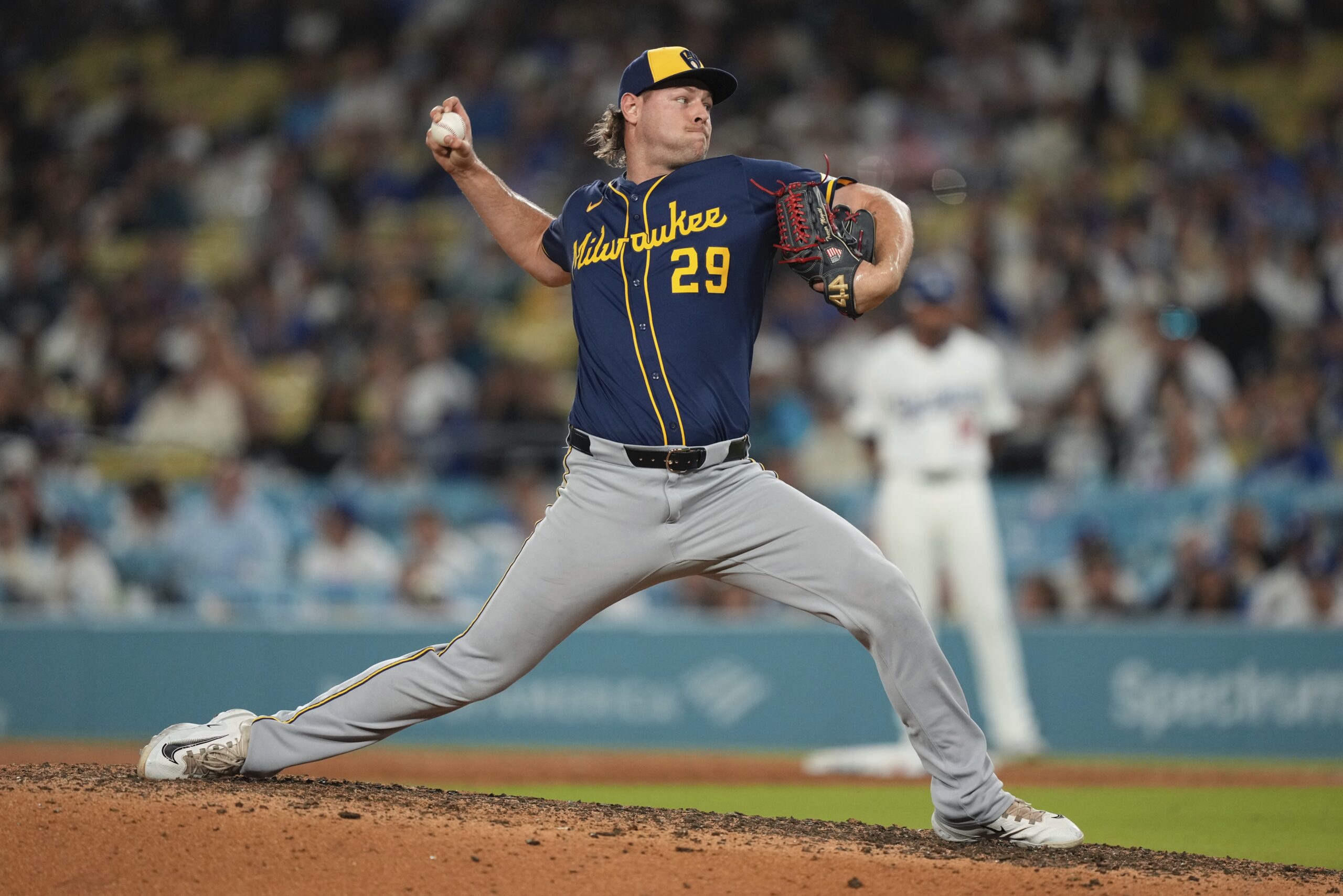 Milwaukee Brewers relief pitcher Trevor Megill throws to the plate...