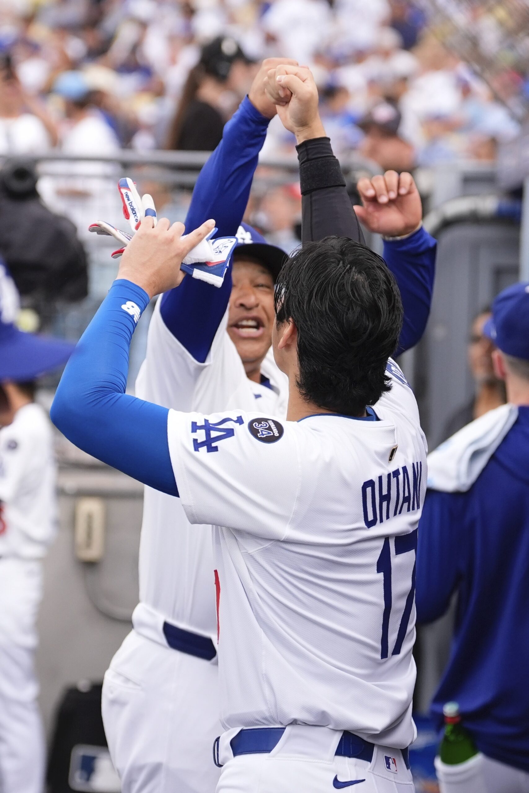 Dodgers manager Dave Roberts, left, and designated hitter Shohei Ohtani...