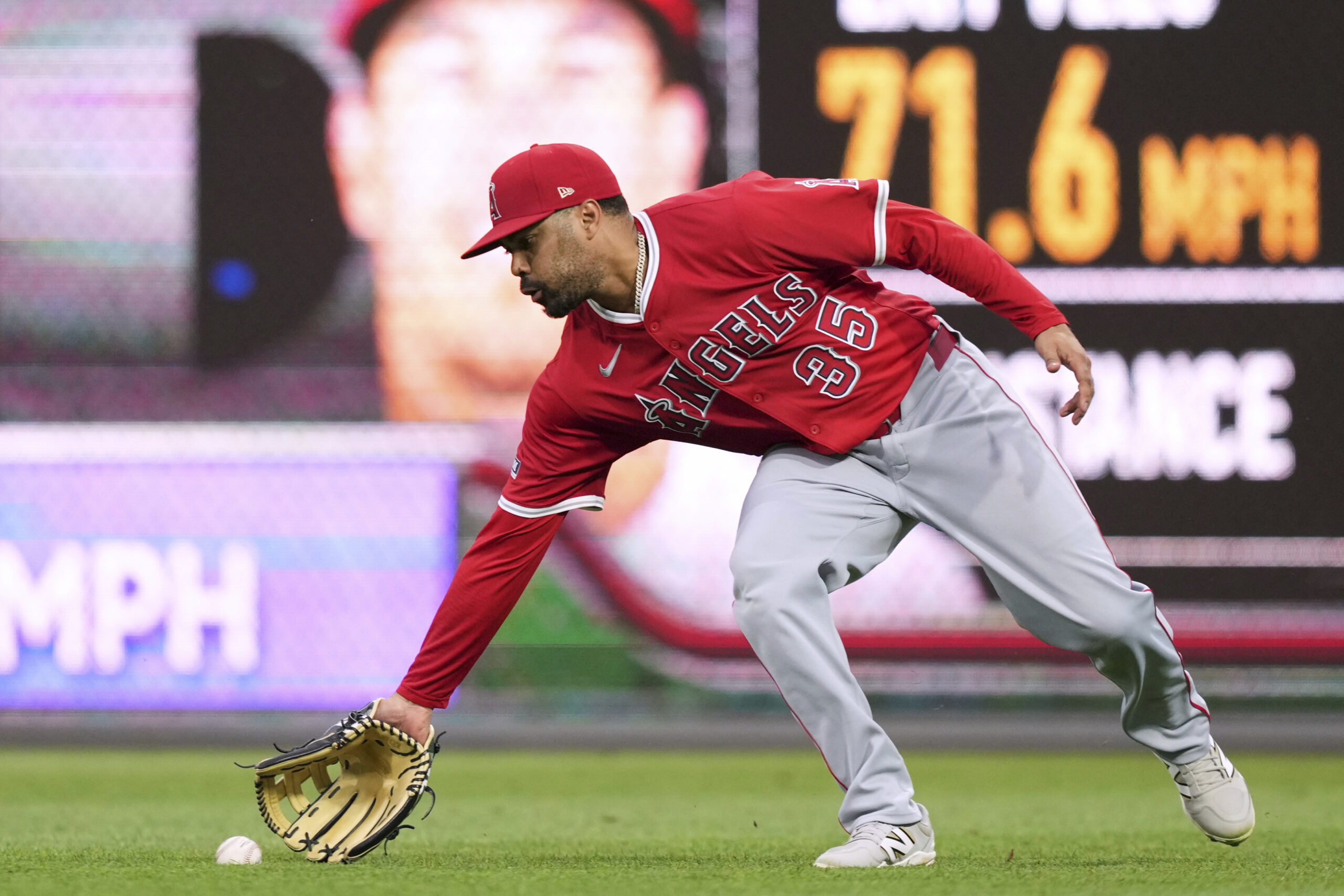 Angels first base LaMonte Wade Jr. fields a single by...