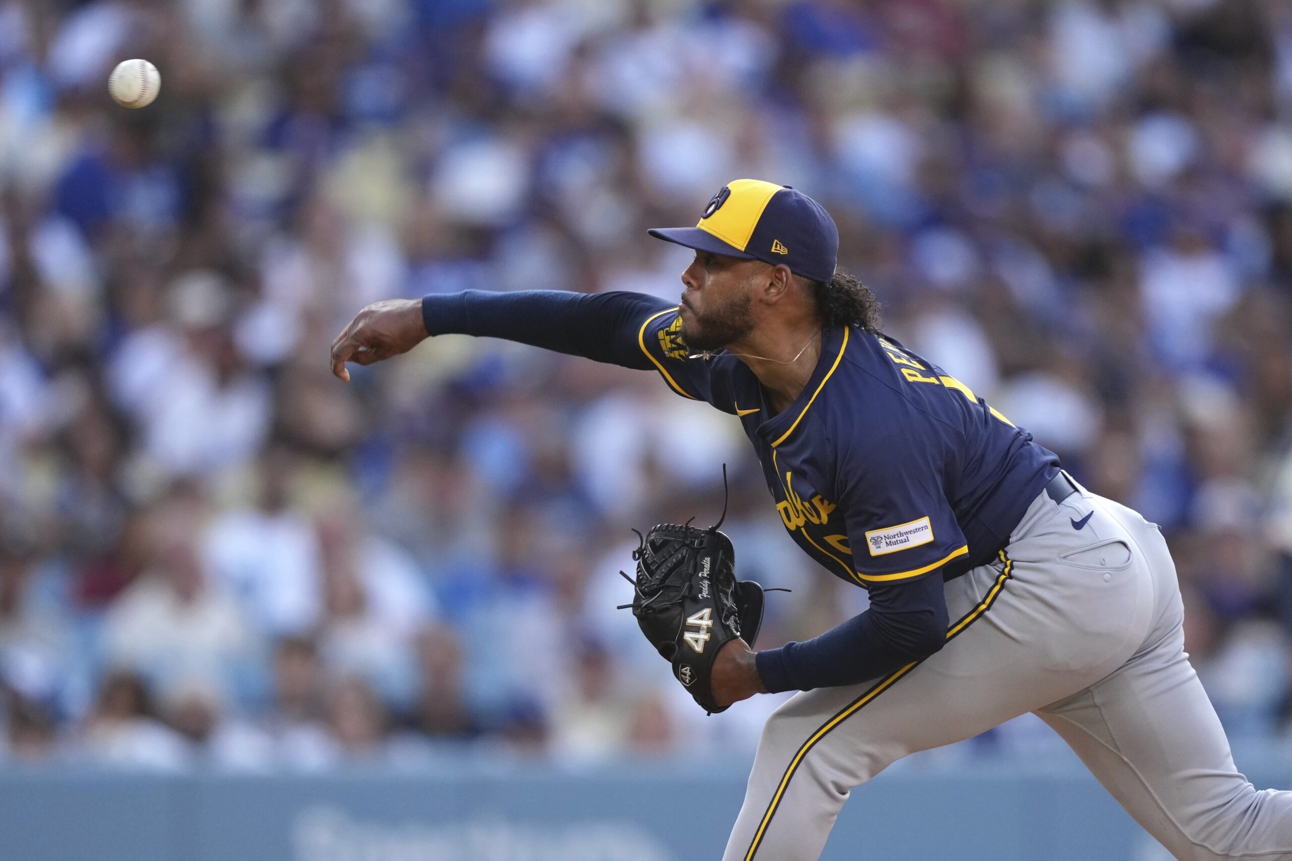 Milwaukee Brewers starting pitcher Freddy Peralta throws to the plate...