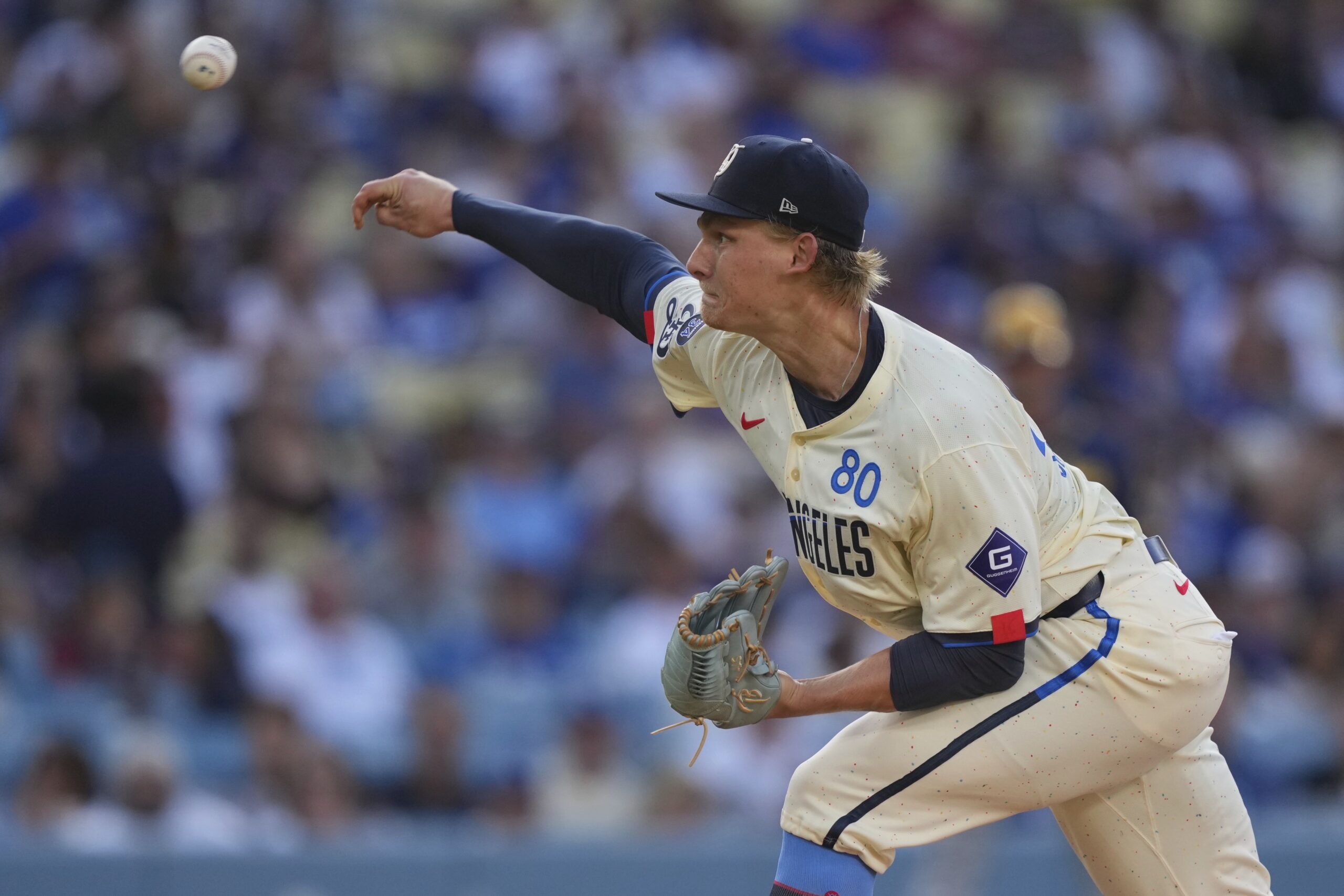 Dodgers starting pitcher Emmet Sheehan throws to the plate during...