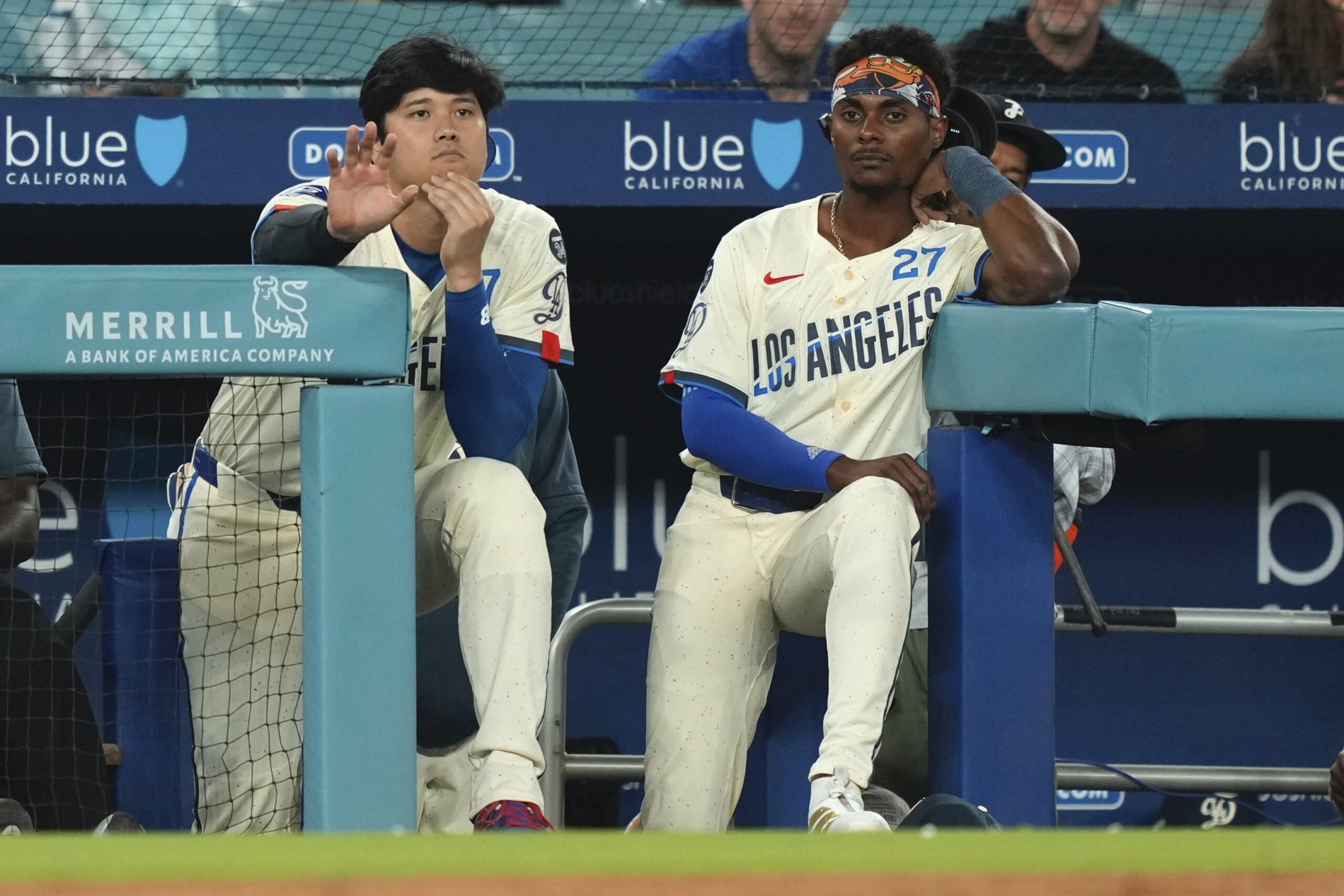 Dodgers’ Shohei Ohtani, left, and Esteury Ruiz watch from the...