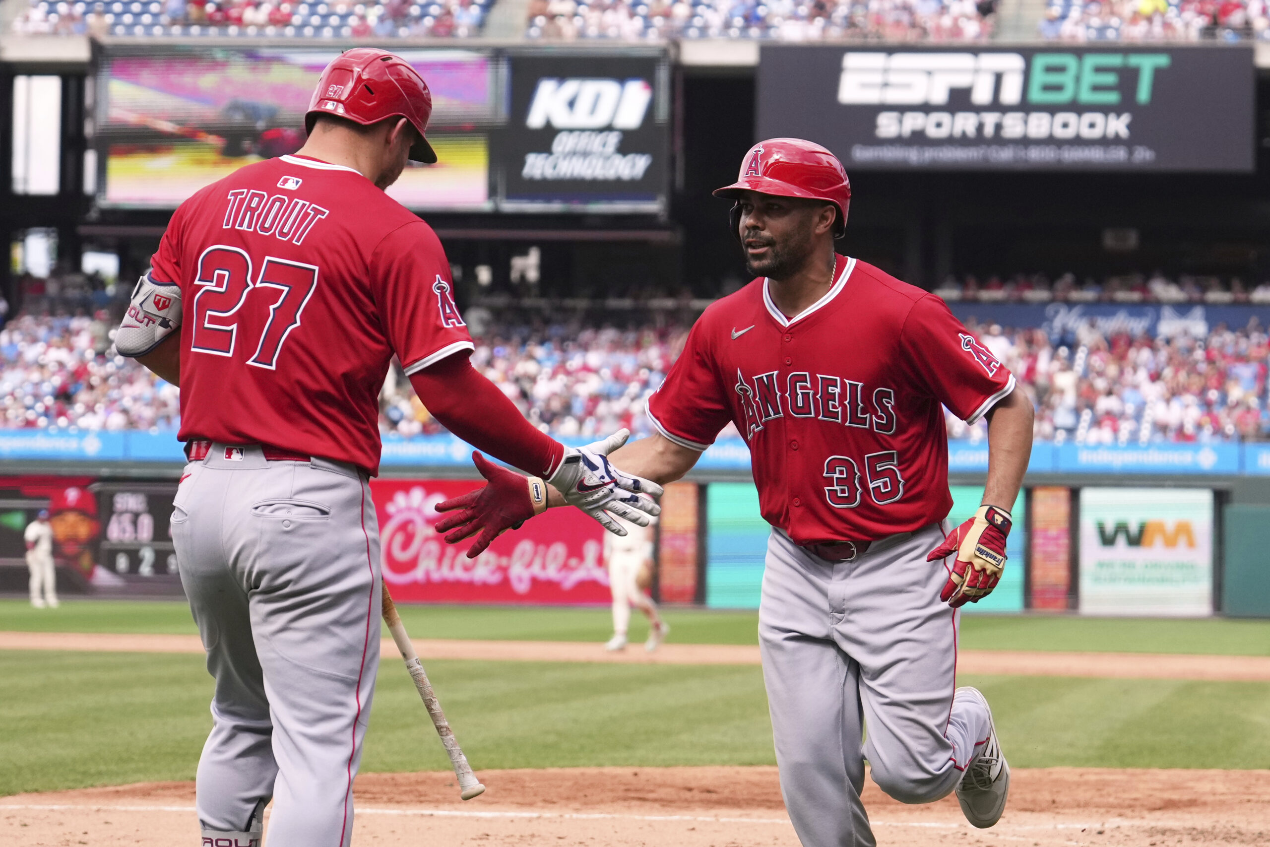 Angels’ LaMonte Wade Jr., right, and Mike Trout celebrate after...