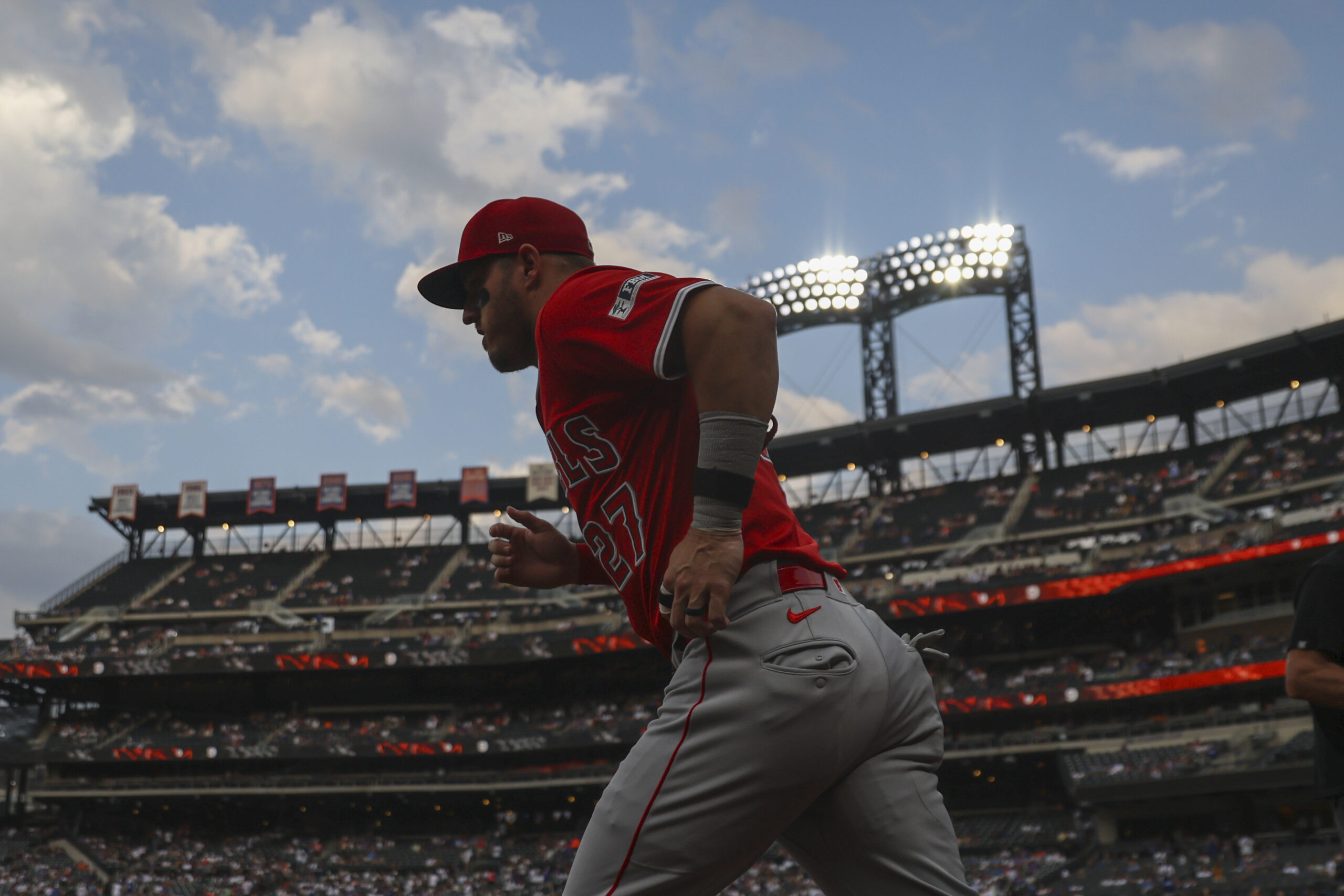 Angels star Mike Trout takes the field before a game...