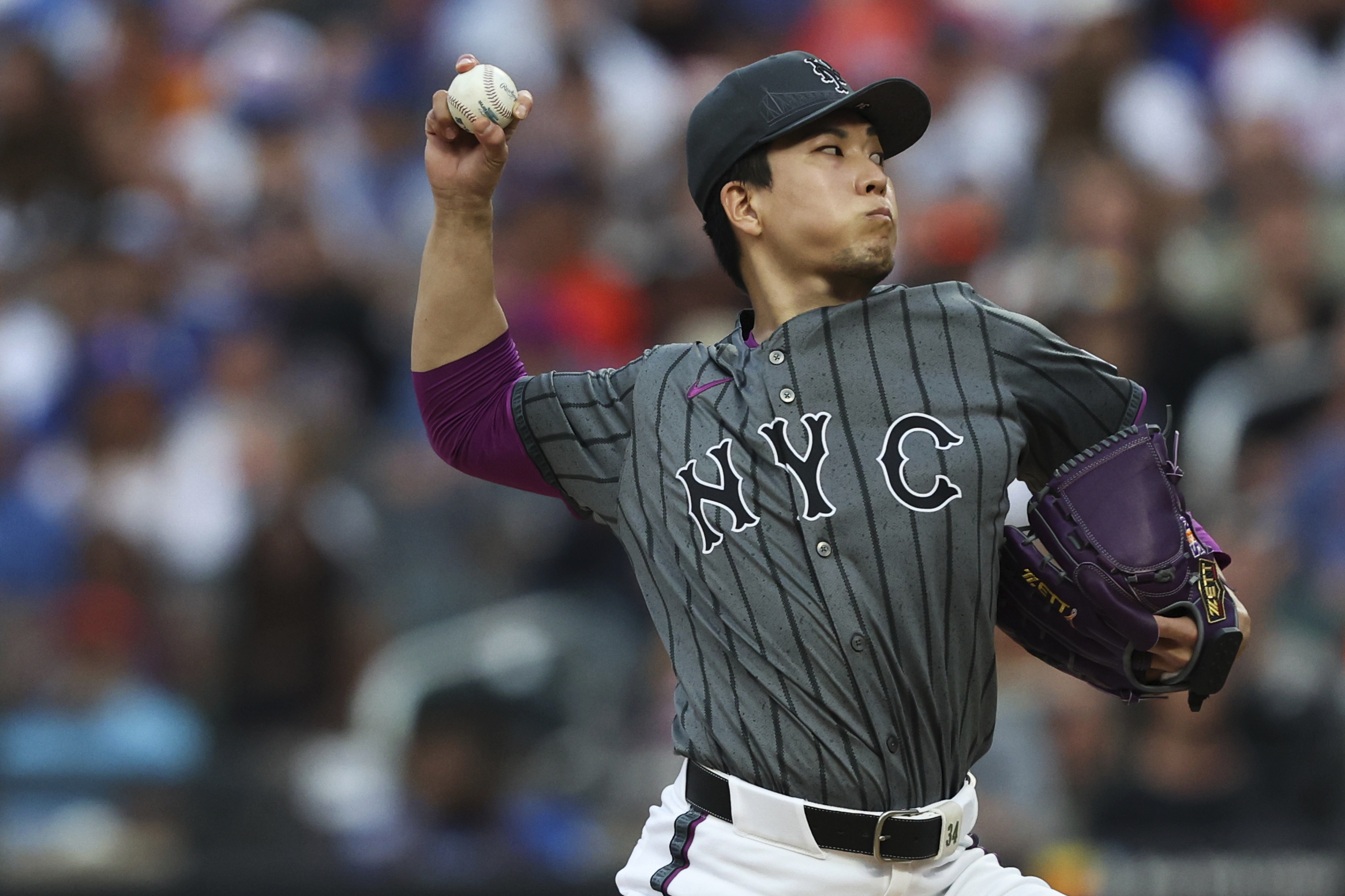 New York Mets starting pitcher Kodai Senga throws to the...