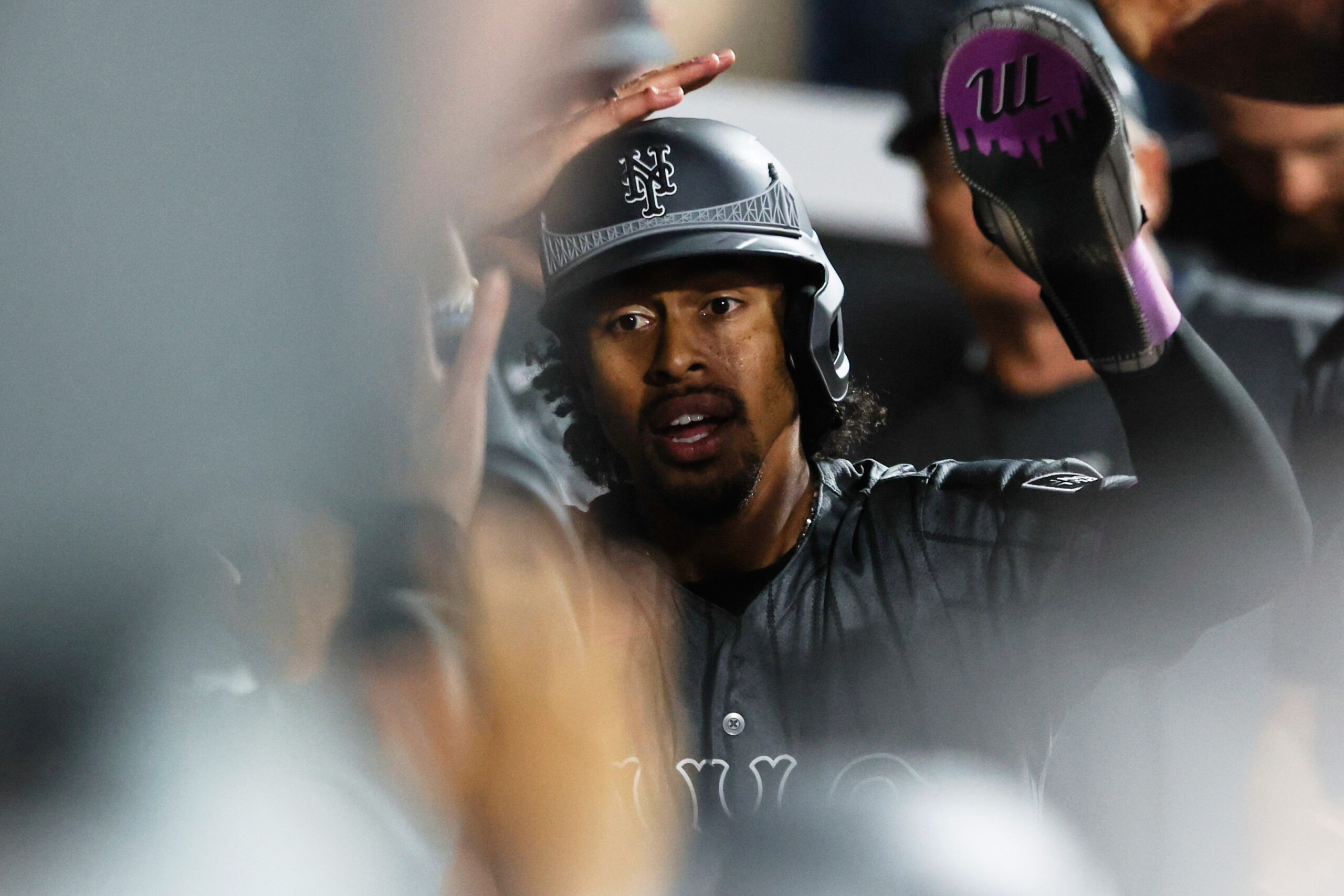 The New York Mets’ Francisco Lindor celebrates in the dugout...