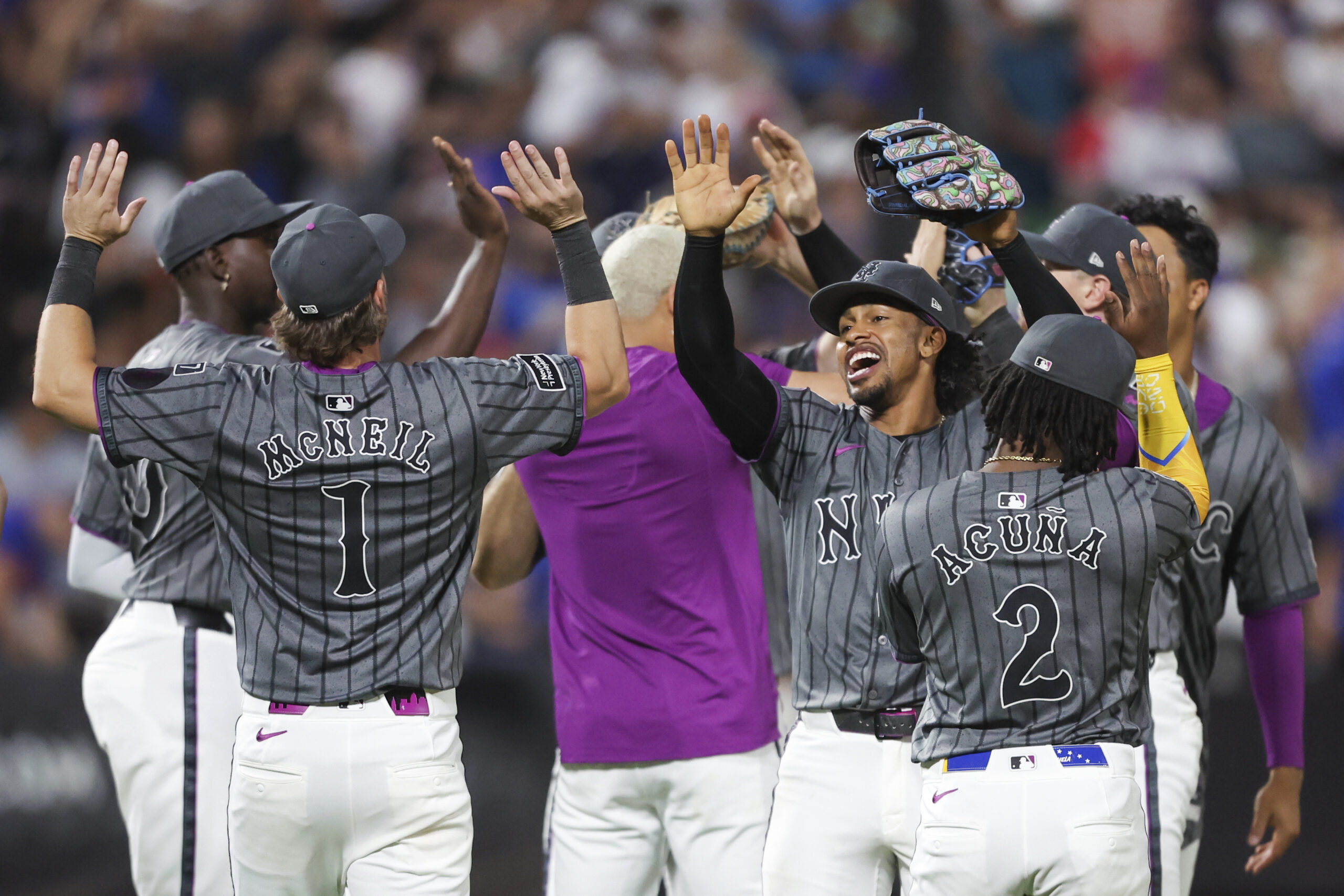 The New York Mets celebrate after a 7-5 comeback win...