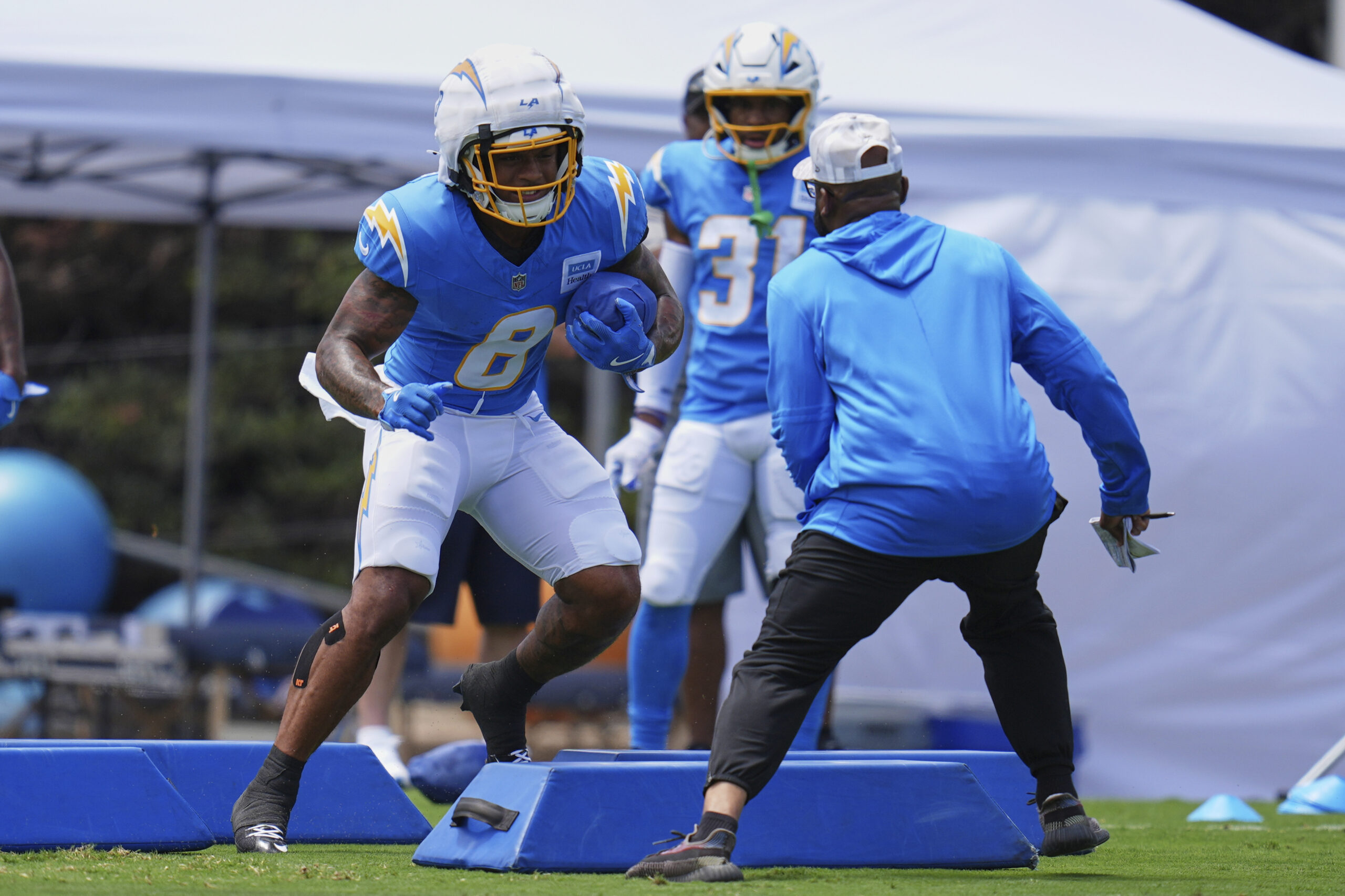 Chargers rookie running back Omarion Hampton goes through a drill...