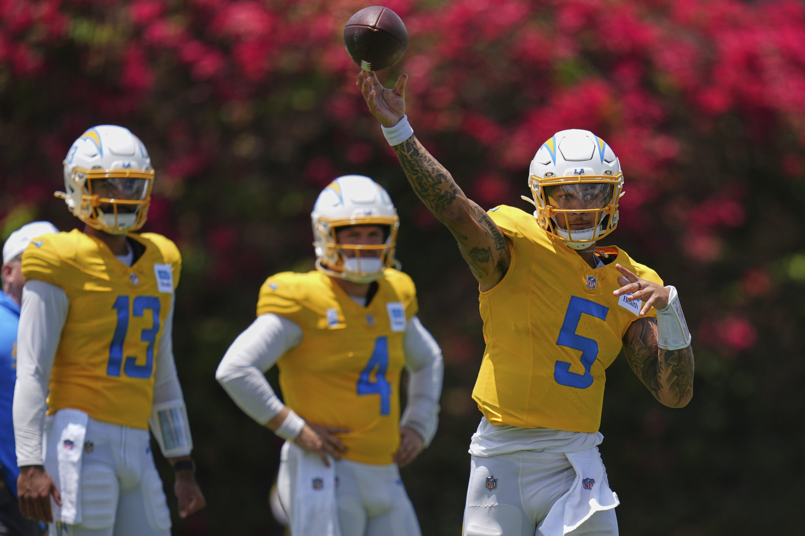 Chargers backup quarterback Trey Lance throws a pass as rookie...