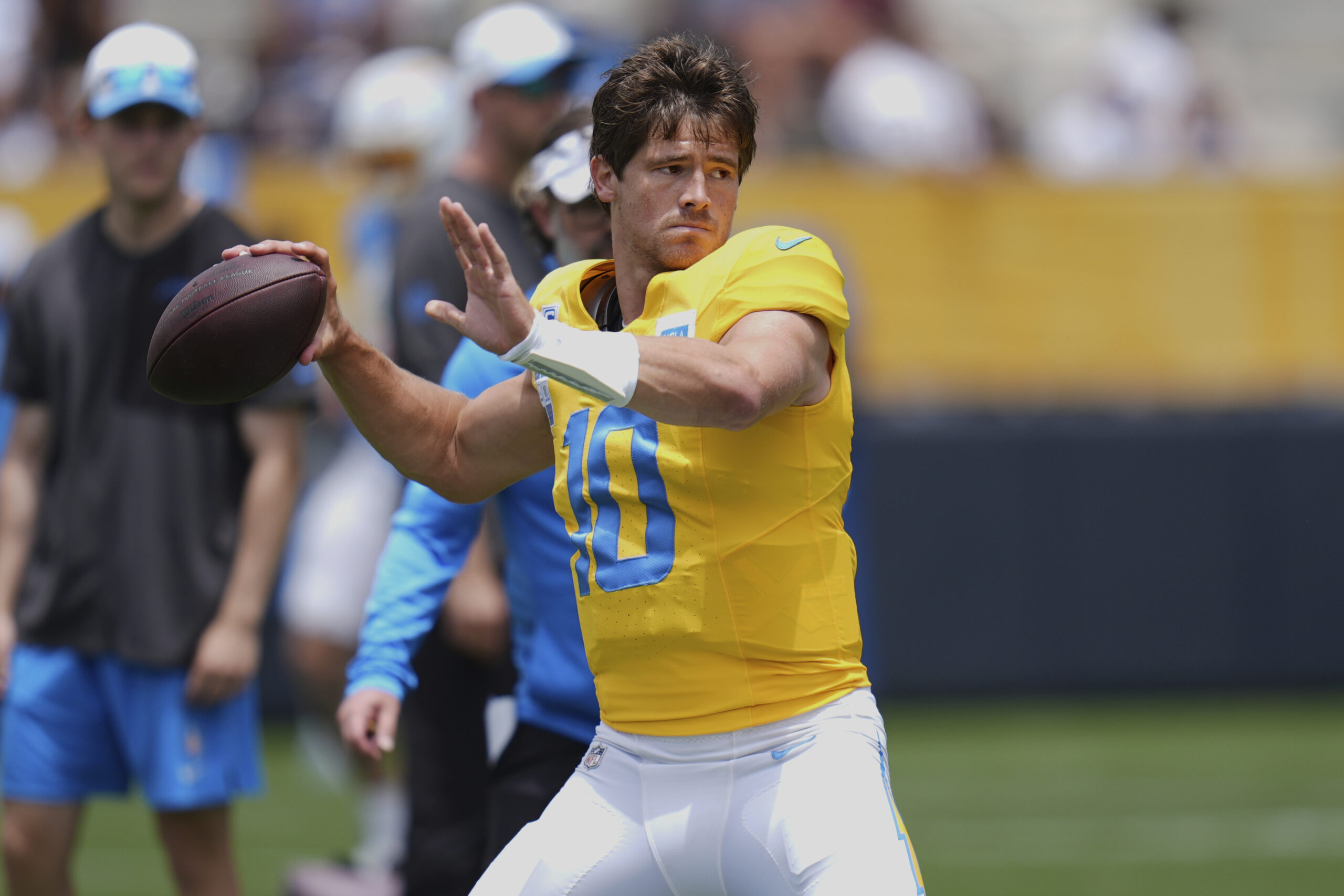Chargers quarterback Justin Herbert throws a pass during a training...