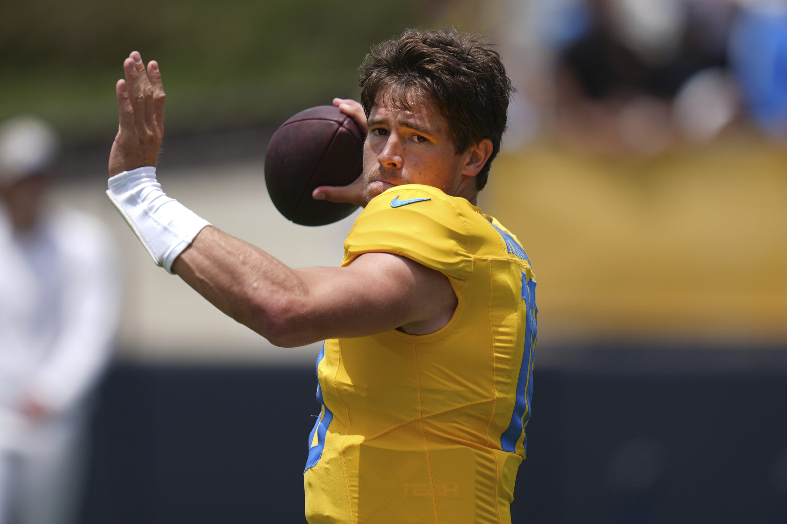Chargers quarterback Justin Herbert throws a pass during a training...