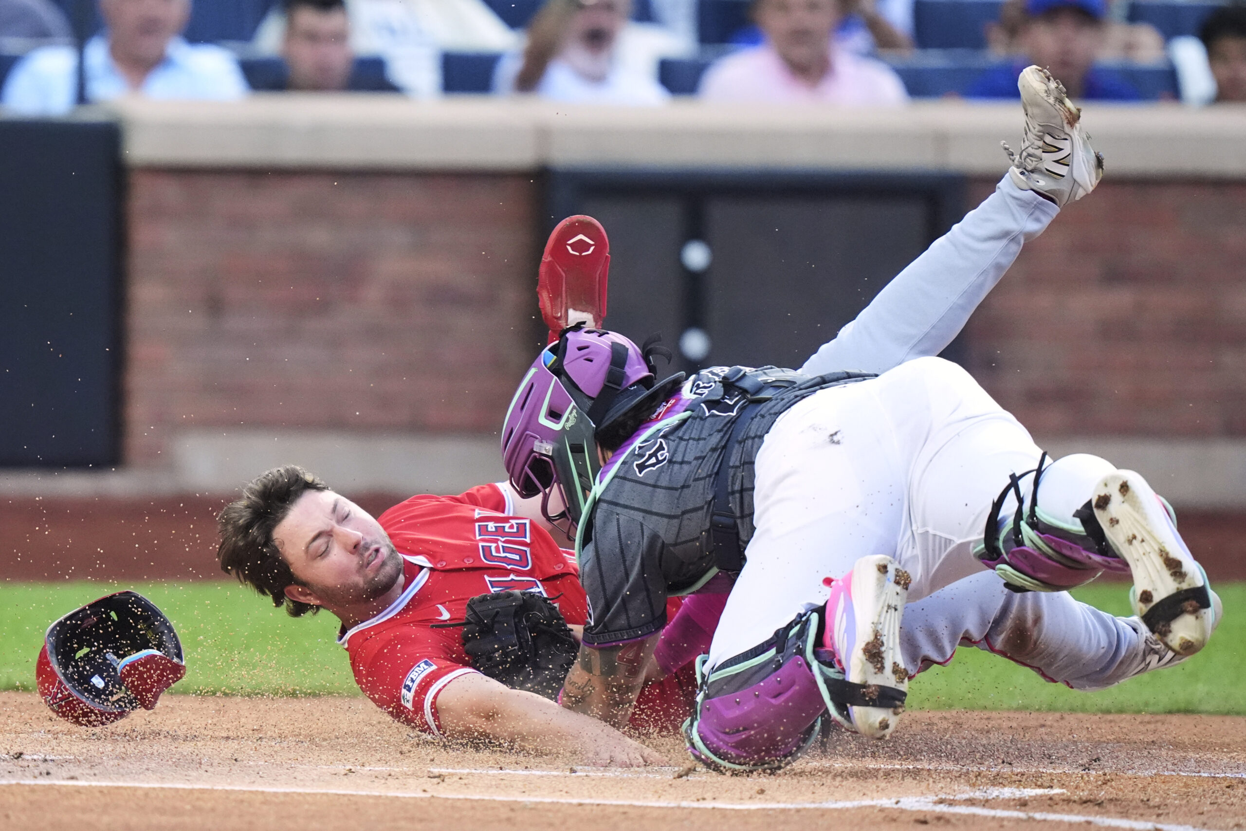 New York Mets catcher Francisco Alvarez, right, tags out the...