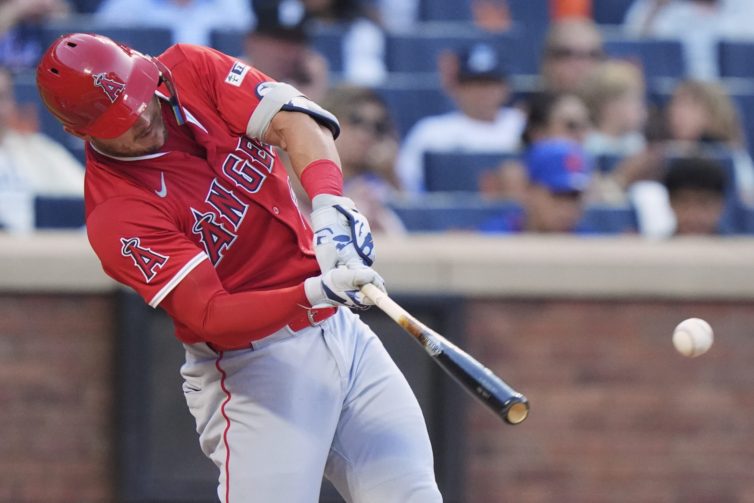 Angels star Mike Trout hits a single during the first...