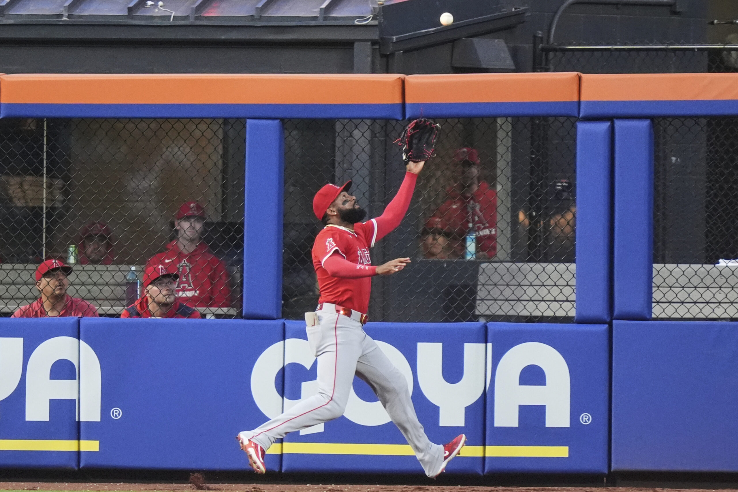 Angels center fielder Jo Adell catches a ball hit by...