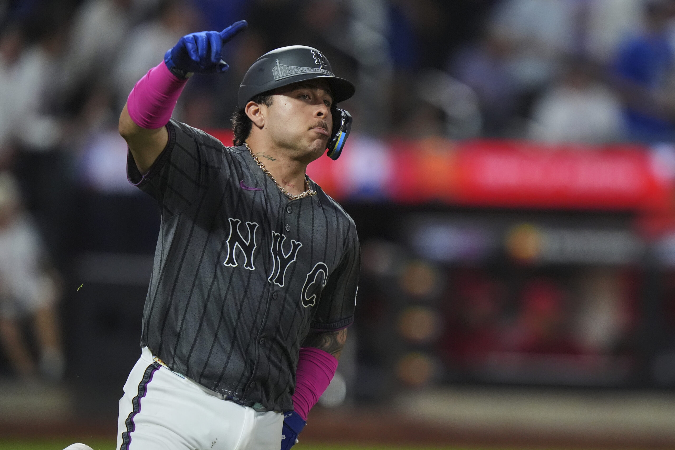 The New York Mets’ Francisco Alvarez gestures as he runs...