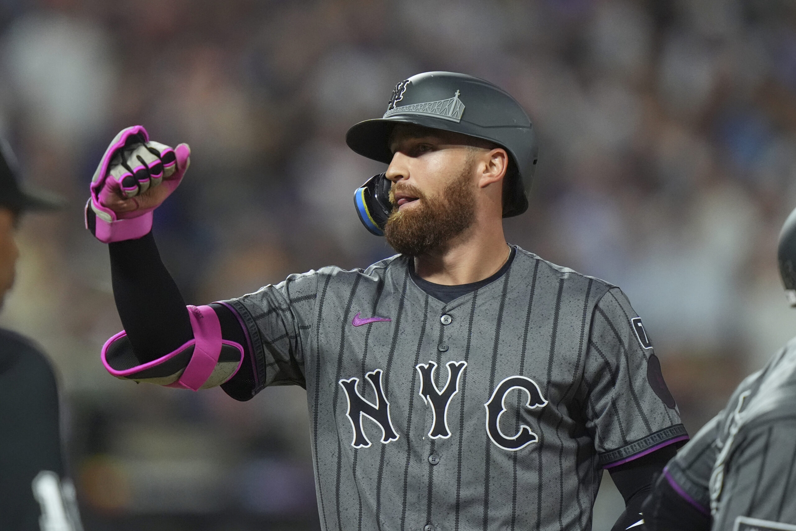 The New York Mets’ Brandon Nimmo gestures to teammates after...