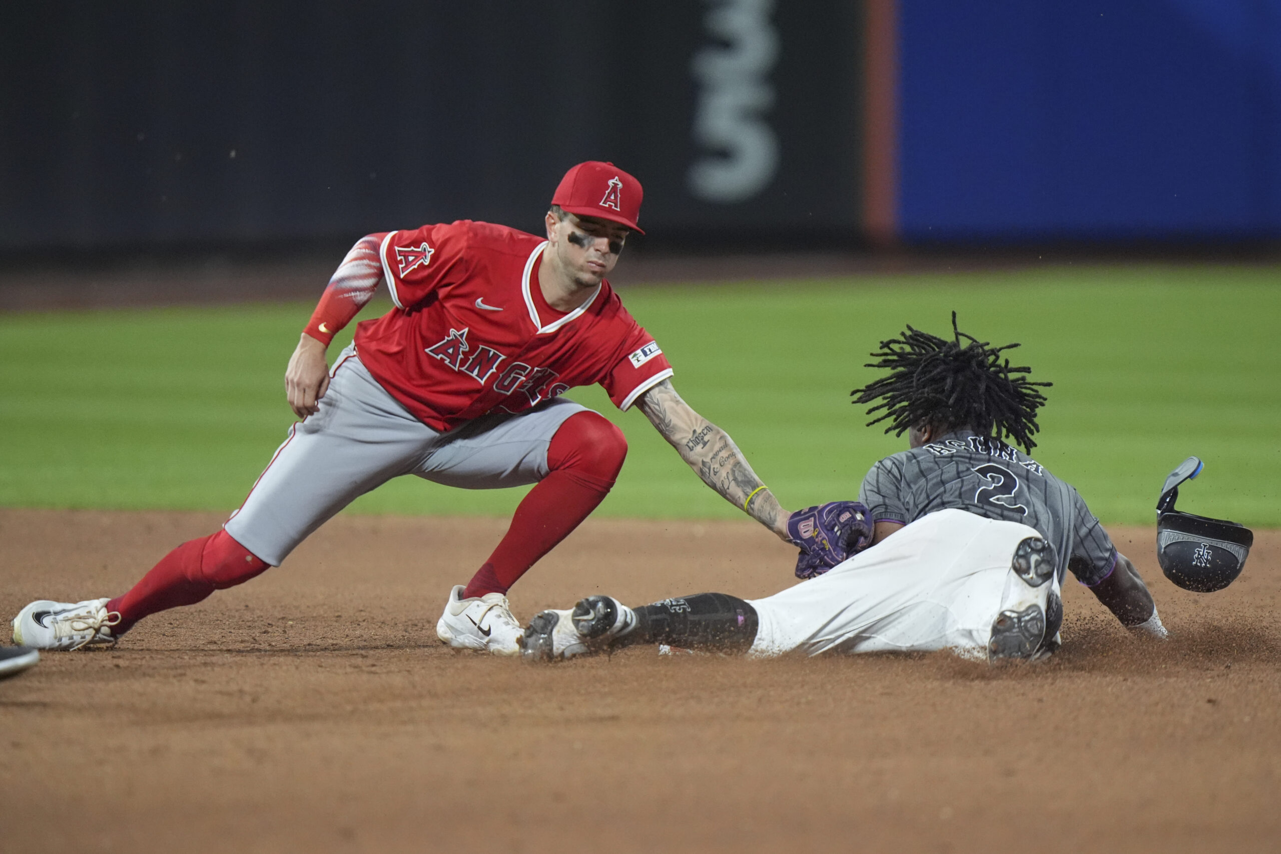 The New York Mets’ Luisangel Acuña steals second base ahead...