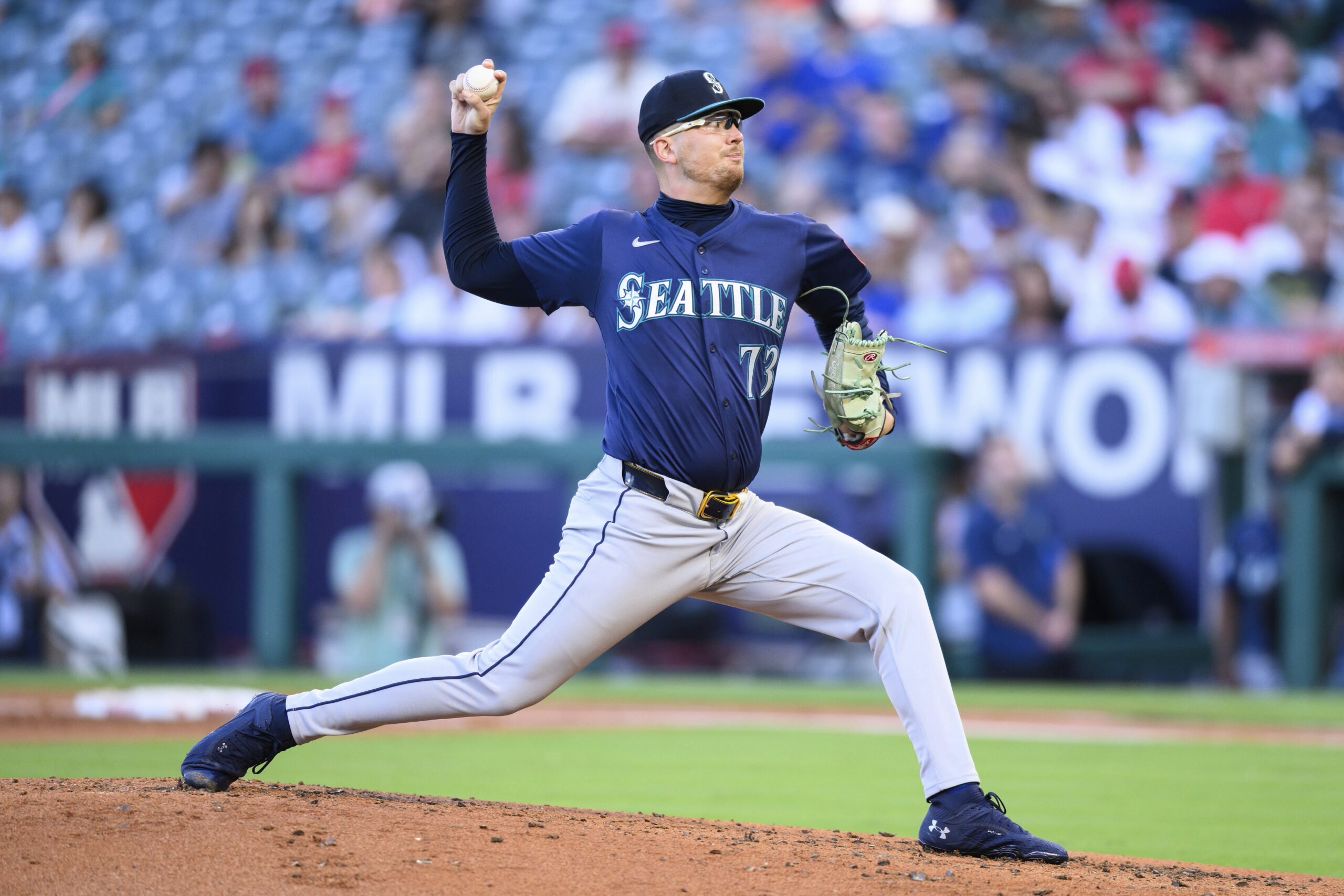 Seattle Mariners pitcher Logan Evans delivers during the first inning...