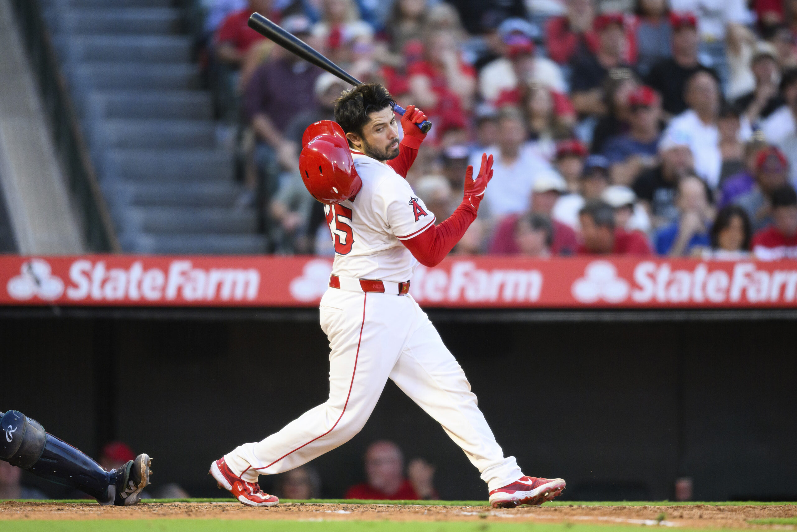 Angels Travis d’Arnaud loses his helmet while swinging during the...