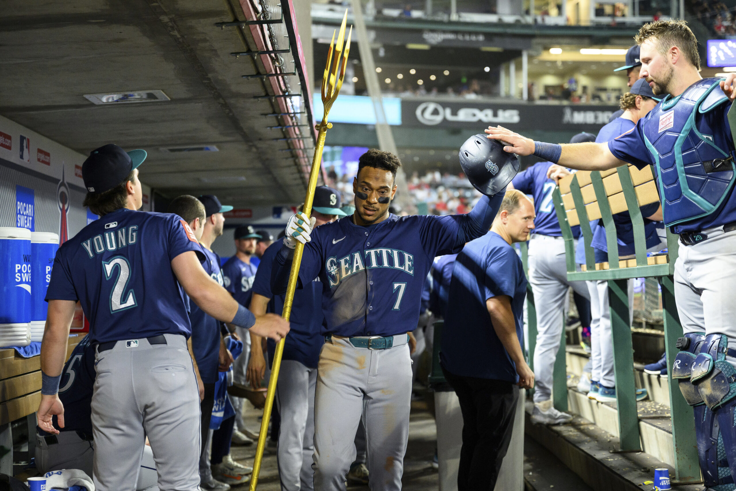 Seattle Mariners Jorge Polanco, center, is greeted by teammates as...