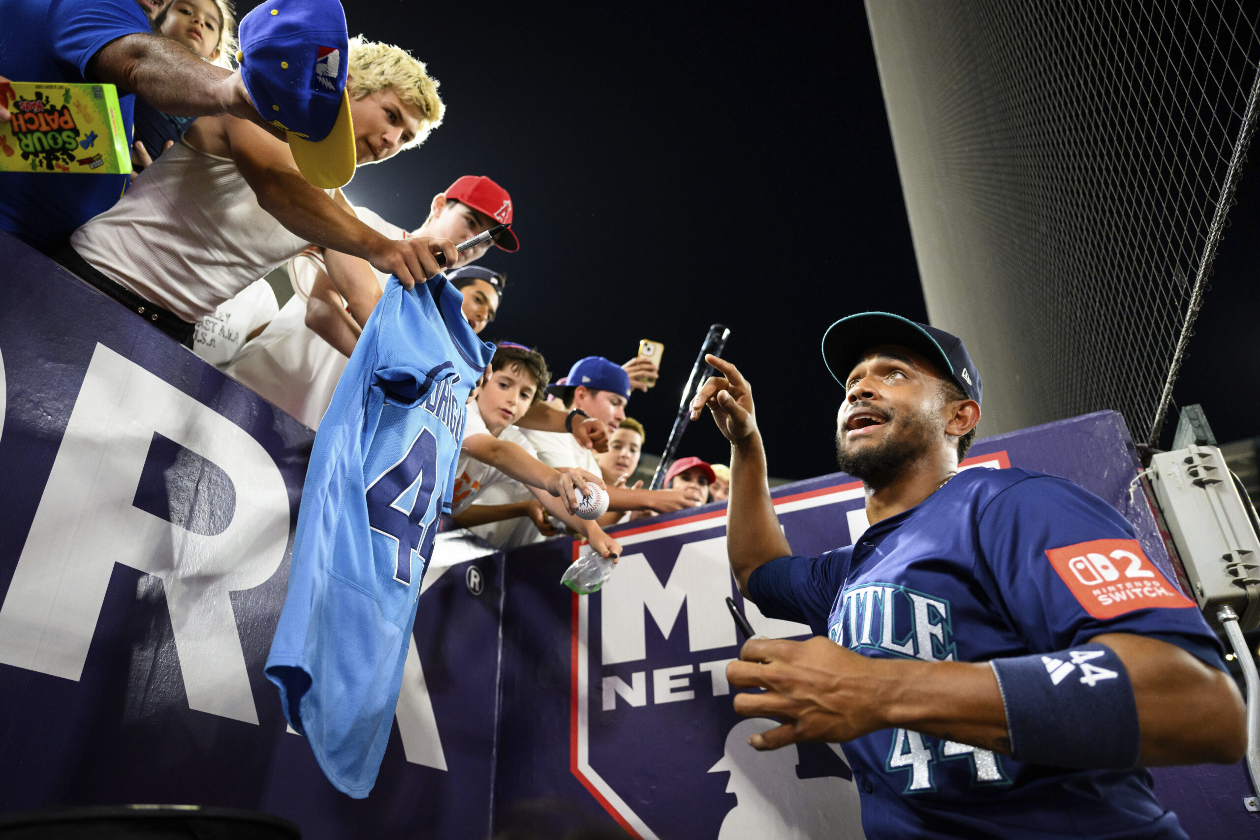Seattle Mariners Julio Rodríguez, right, greets fans after winning a...