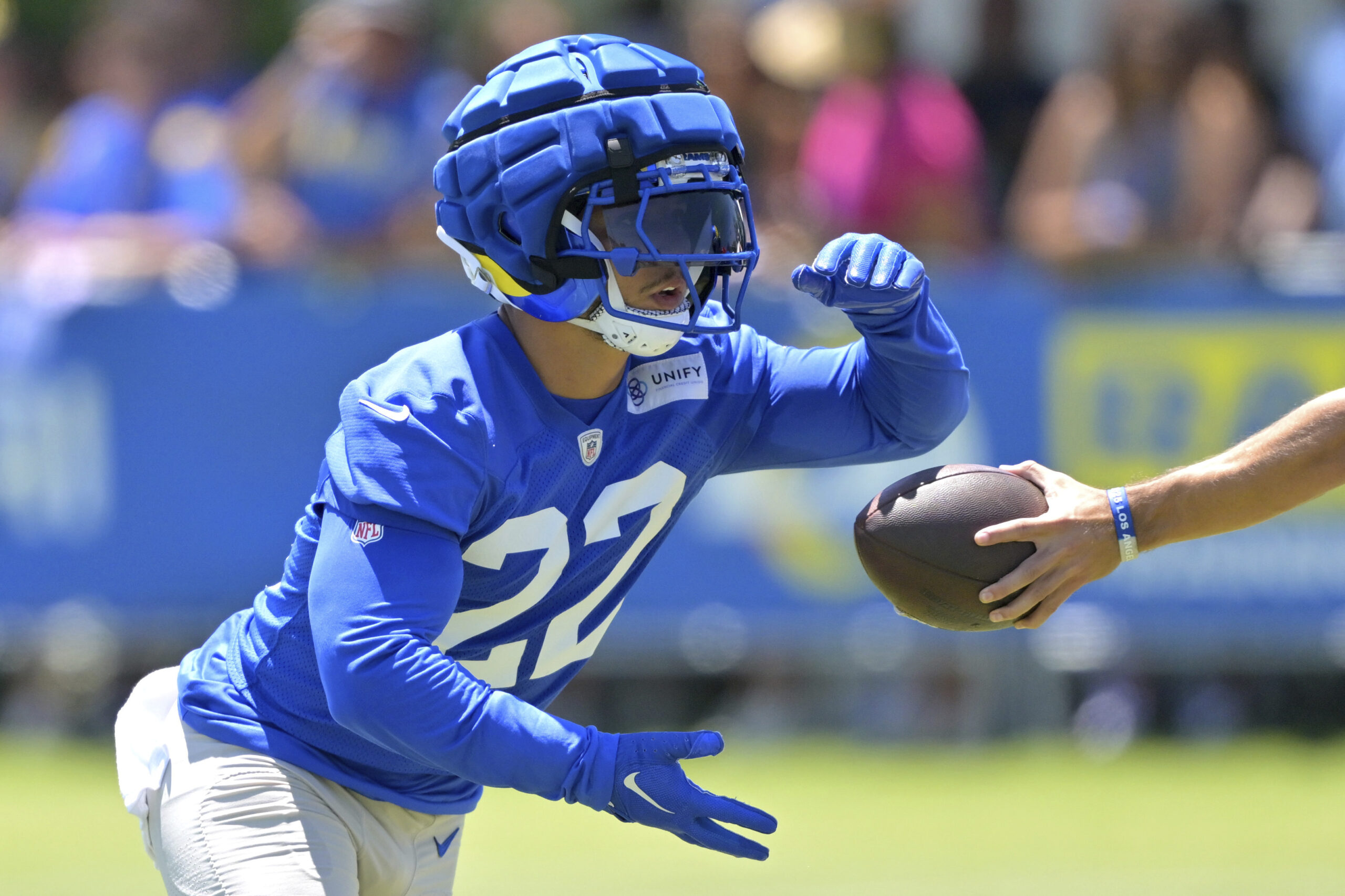Rams running back Blake Corum takes a handoff during a...