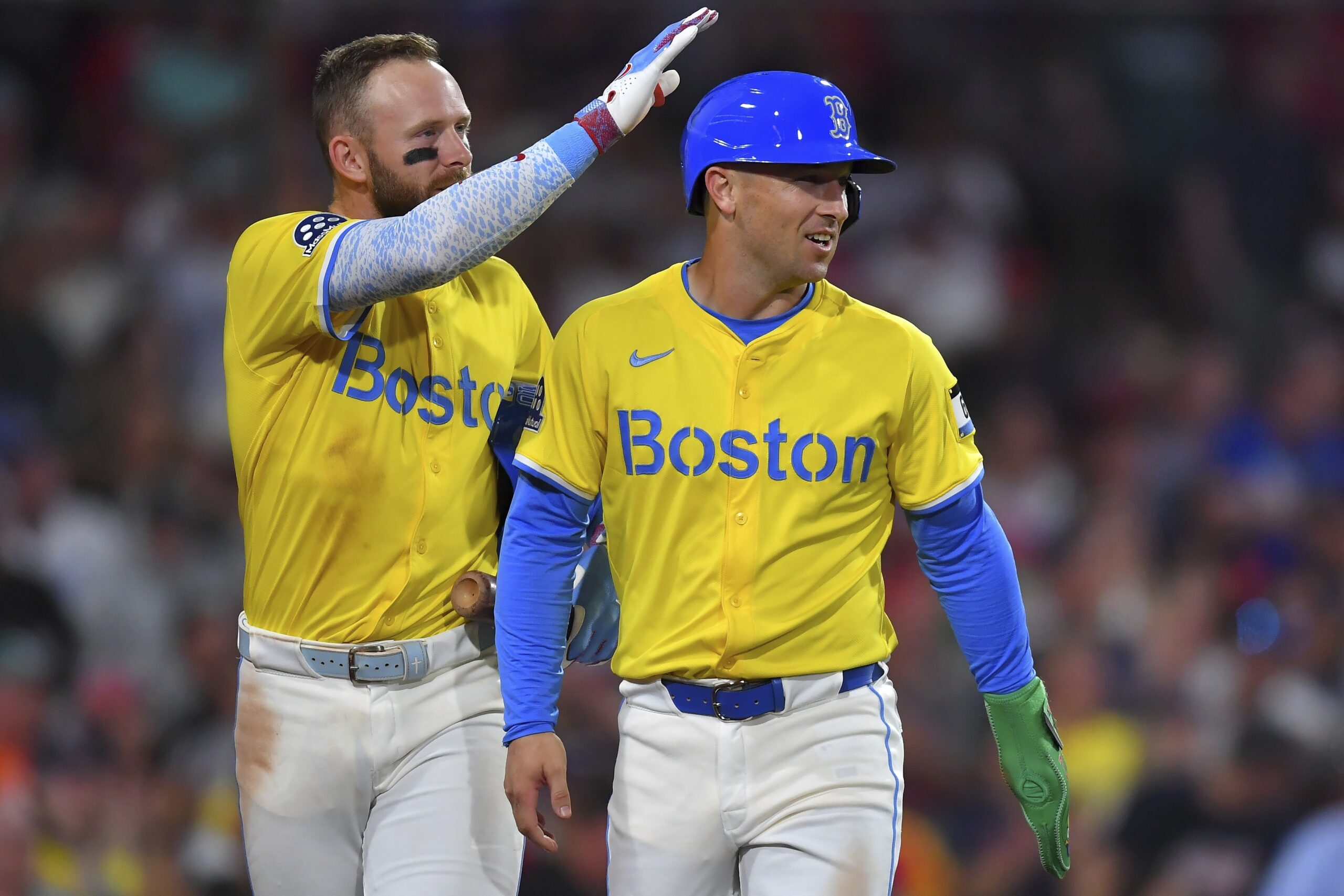 Boston Red Sox’s Alex Bregman, right, celebrates with Trevor Story,...