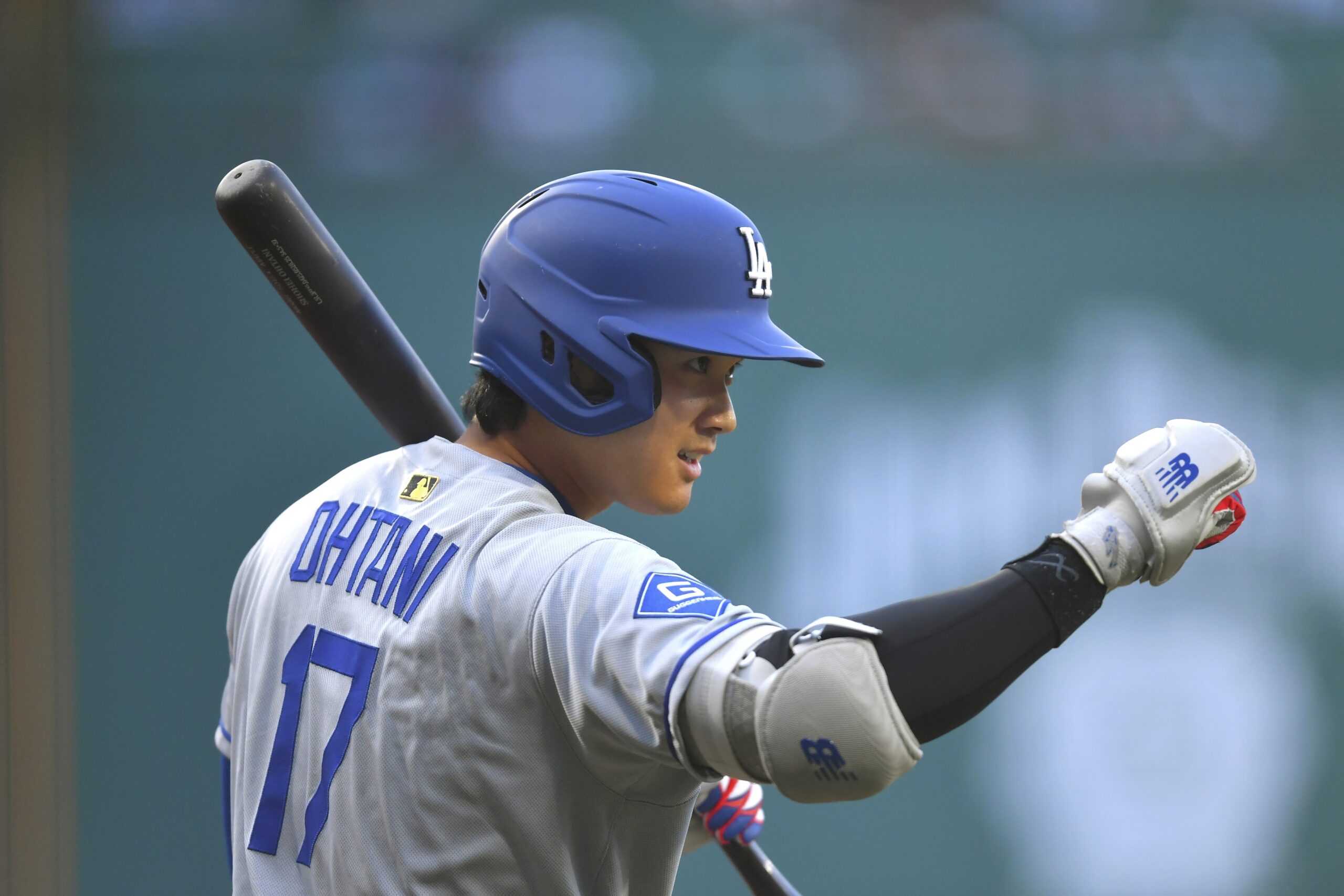 Dodgers’ Shohei Ohtani gestures before taking an at-bat in the...