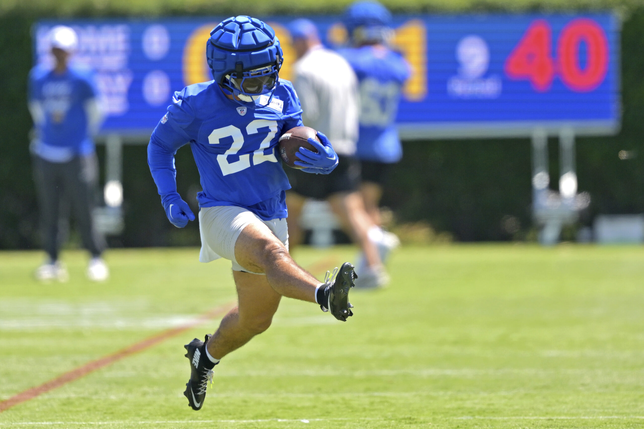 Rams running back Blake Corum runs with the ball during...