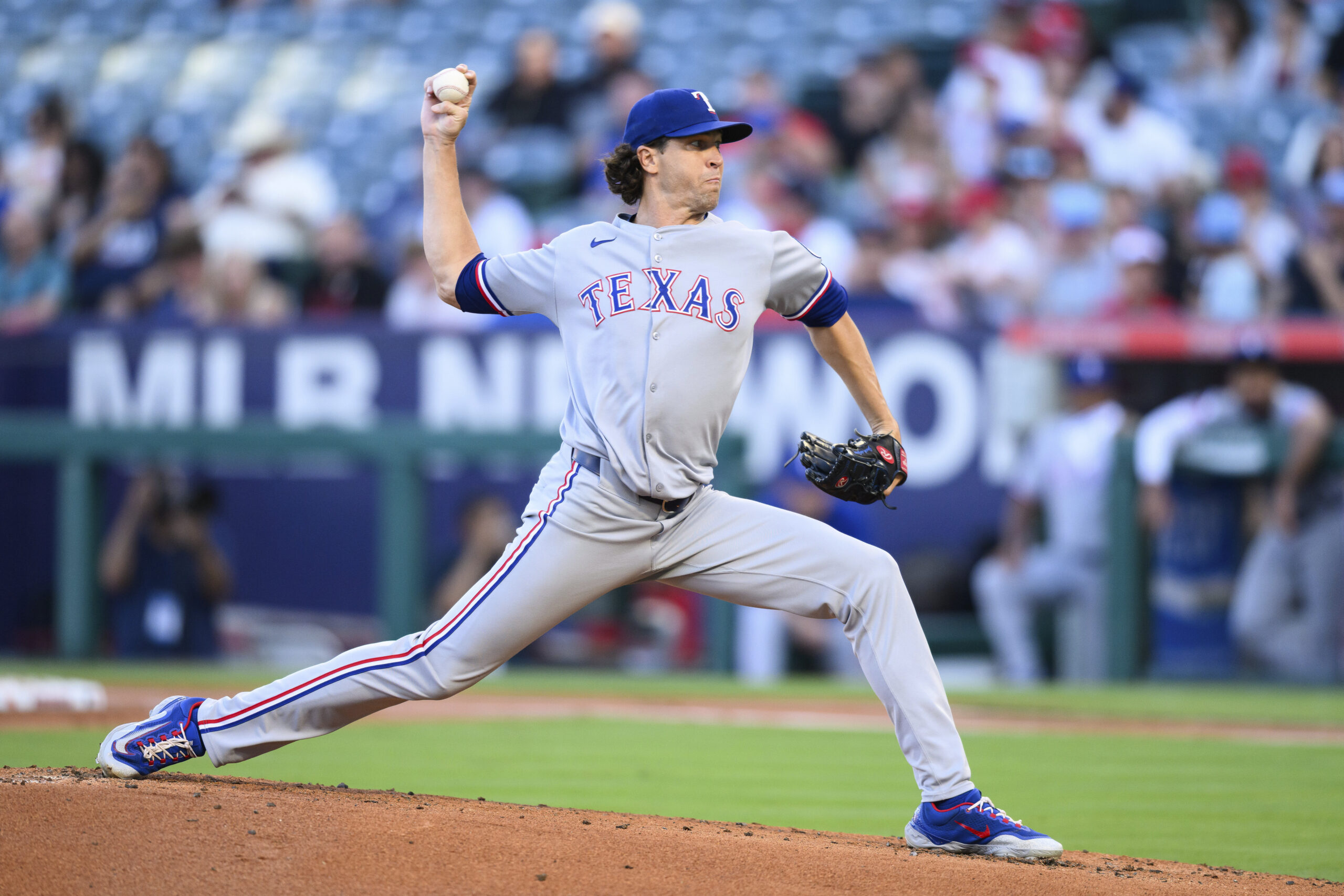 Texas Rangers starting pitcher Jacob deGrom throws to the plate...