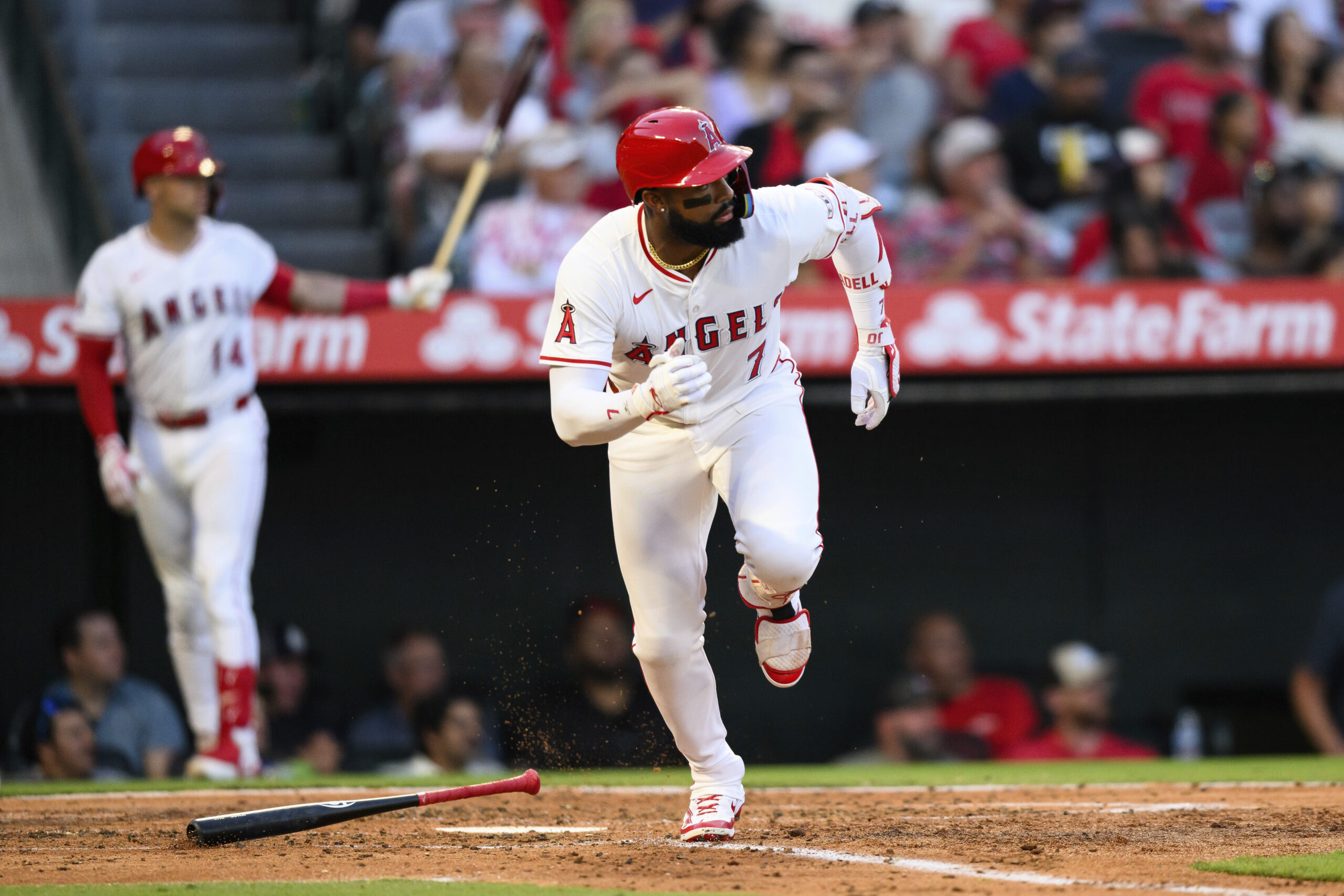 The Angels’ Jo Adell runs after hitting a single during...