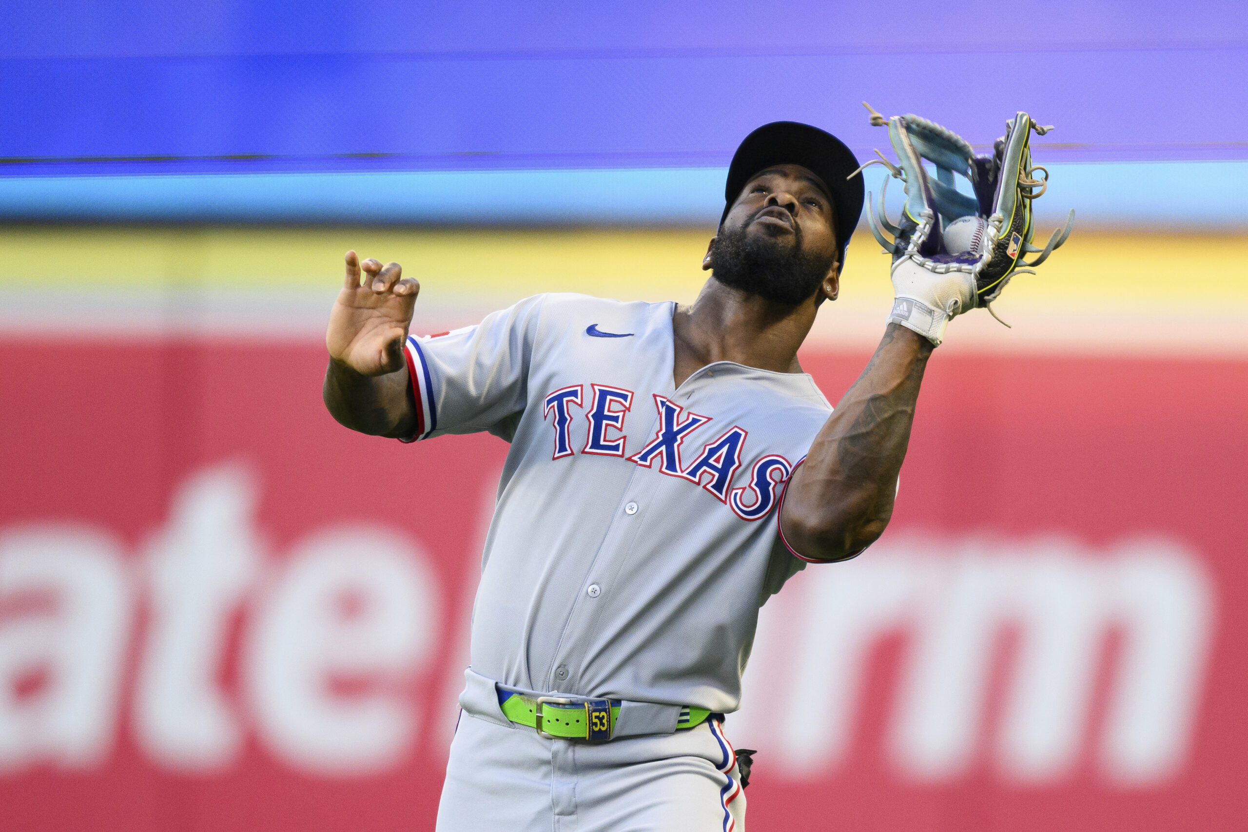 Texas Rangers right fielder Adolis García makes a catch during...