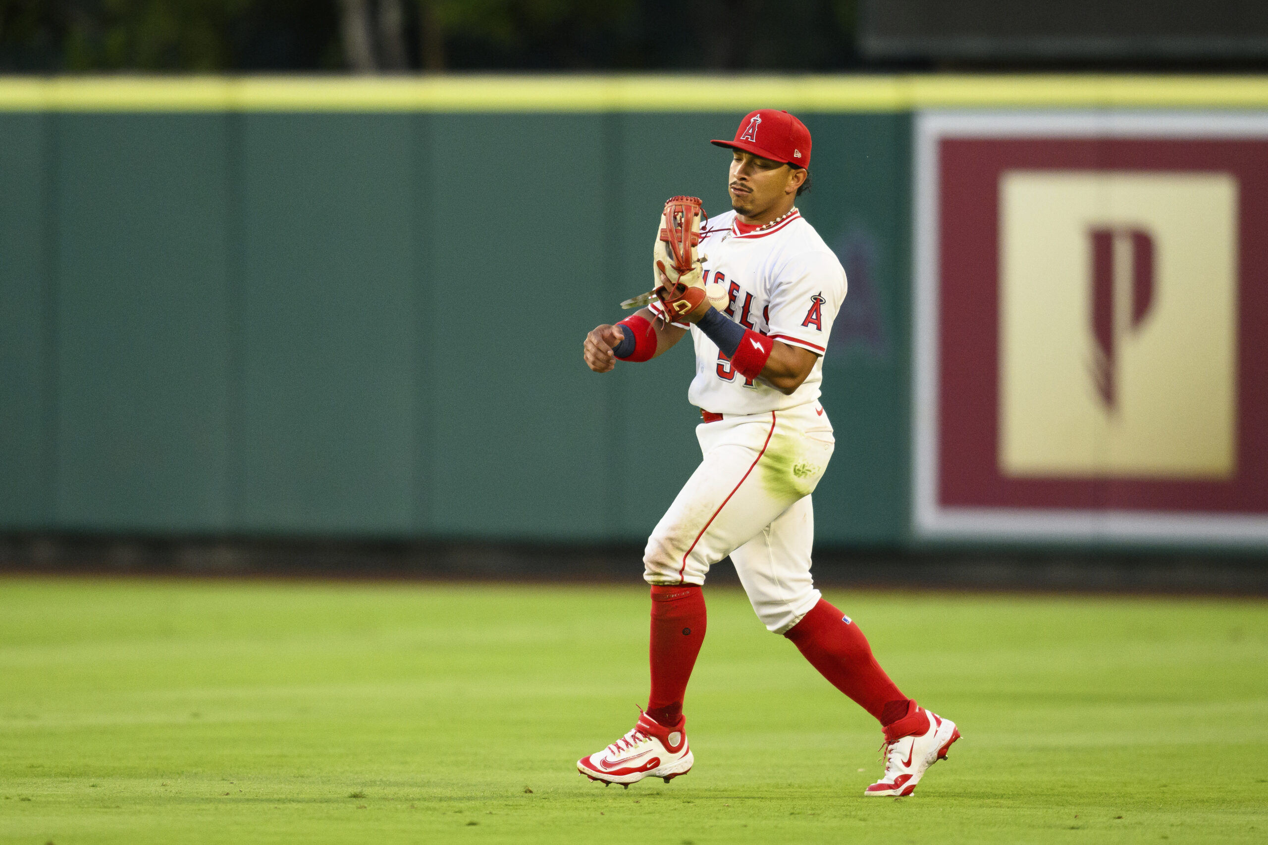 Angels right fielder Gustavo Campero makes an error while trying...
