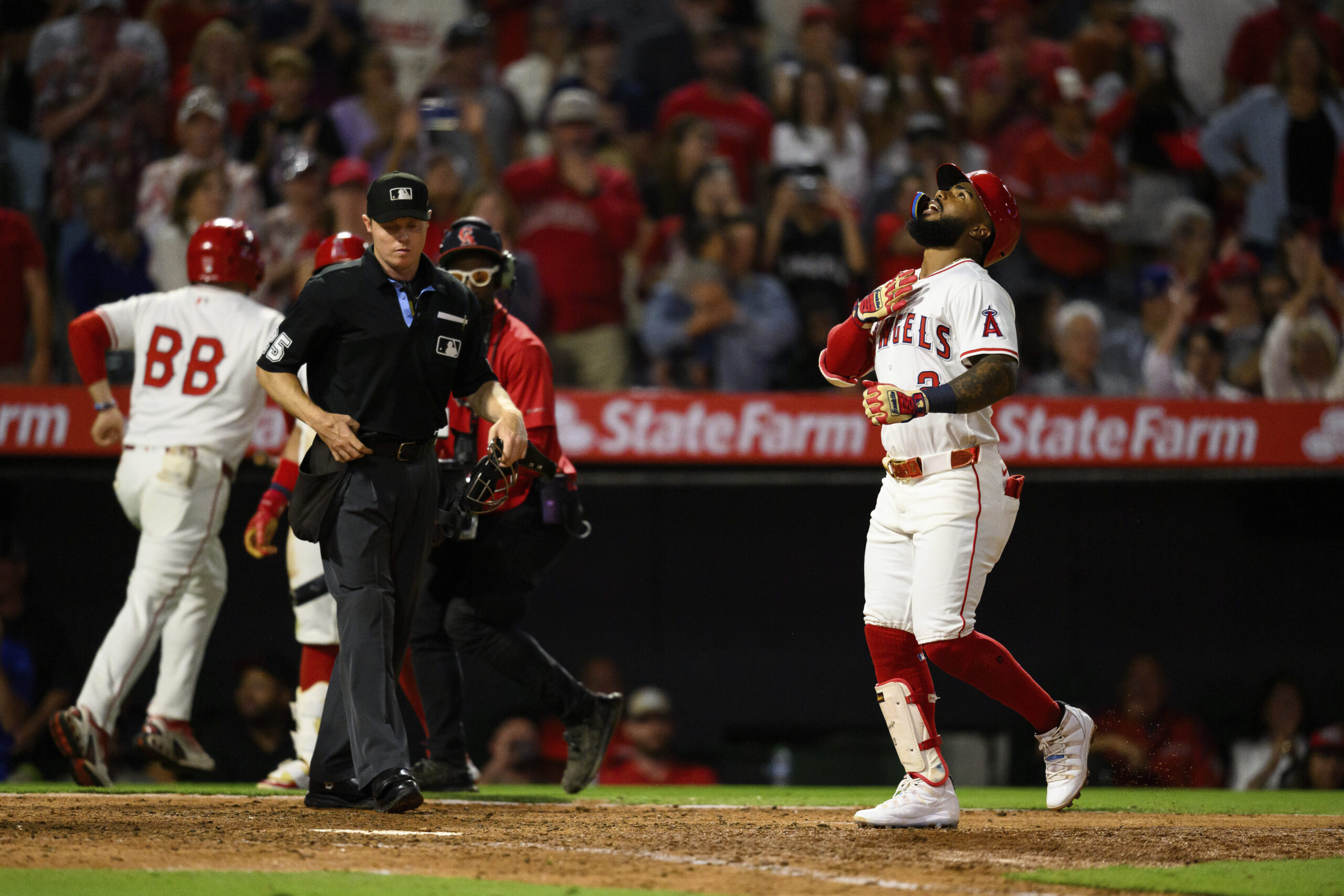 The Angels’ Luis Rengifo gestures after hitting a two-run home...