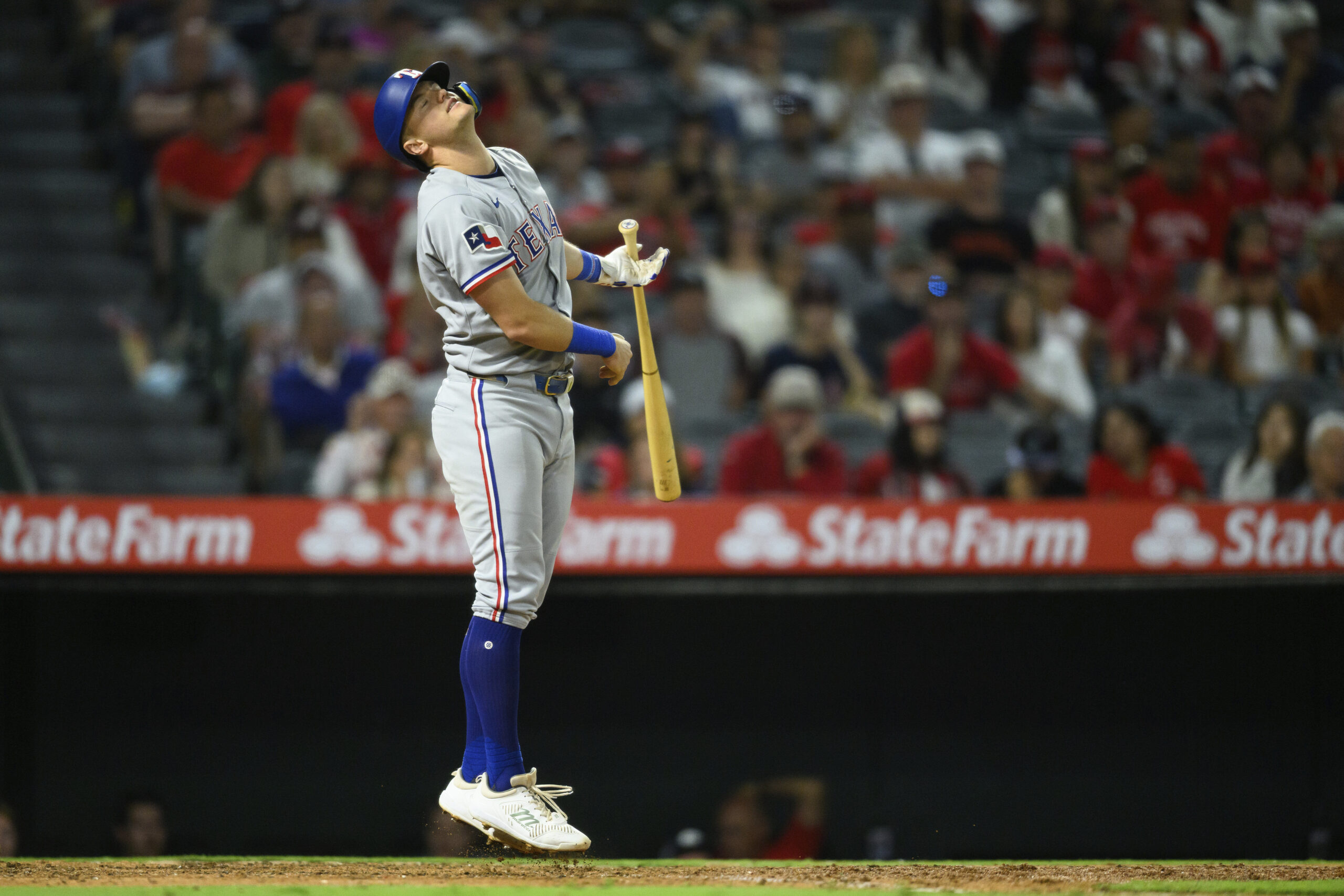 The Texas Rangers’ Josh Jung reacts after striking out during...