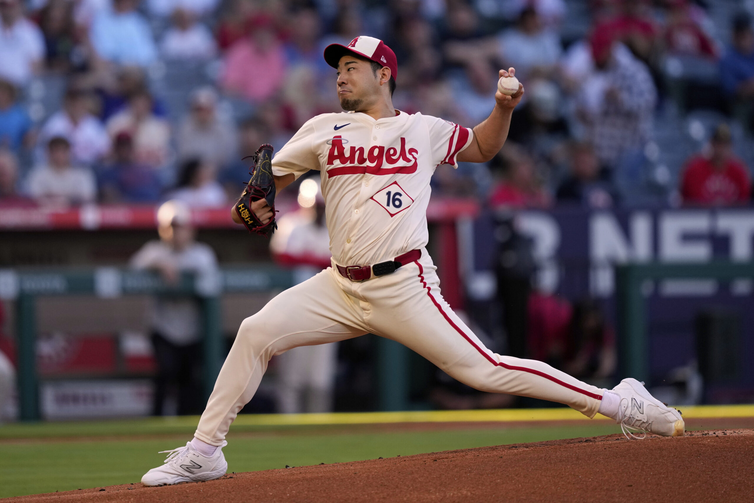 Angels starting pitcher Yusei Kikuchi throws to the plate during...